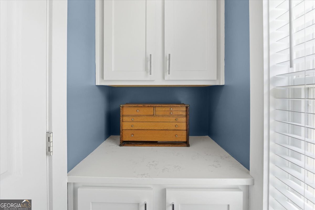731 Markhams Drive Madison, GA 30650 - Photo 29 of 68 a view of an empty room with wooden floor and a window