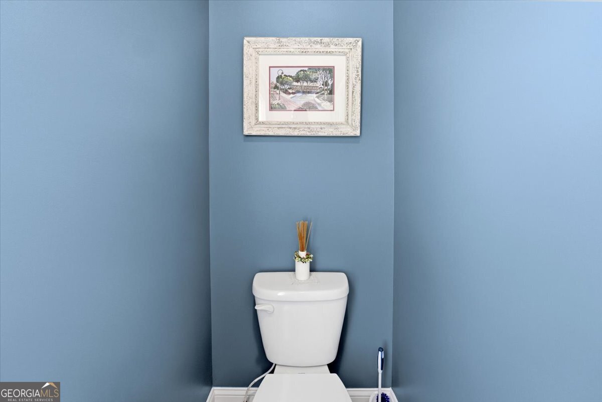 731 Markhams Drive Madison, GA 30650 - Photo 30 of 68 a bathroom with a toilet and a sink