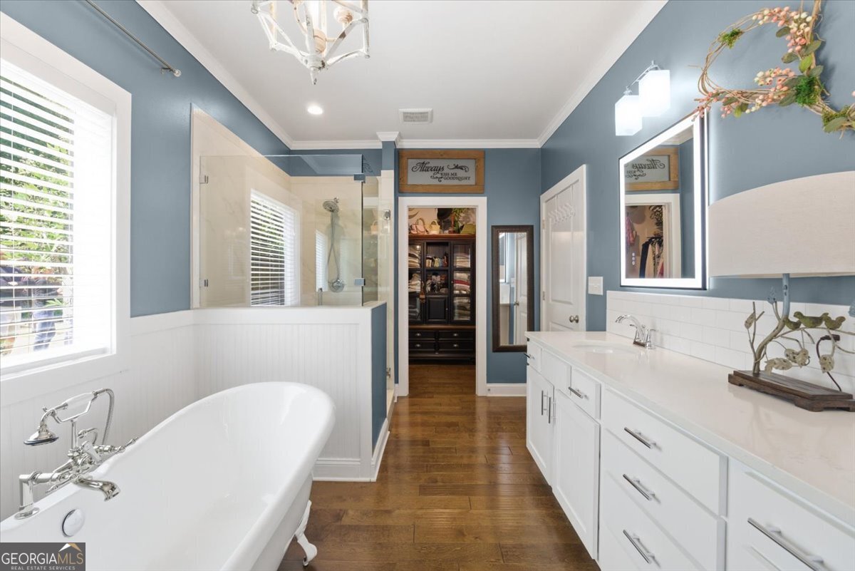 731 Markhams Drive Madison, GA 30650 - Photo 32 of 68 a spacious en suite bathroom with a double vanity sink a large mirror and a shower