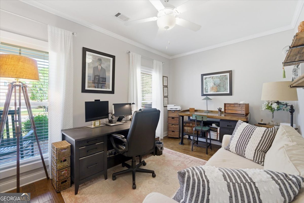 731 Markhams Drive Madison, GA 30650 - Photo 37 of 68 a view of a livingroom with workspace and a window
