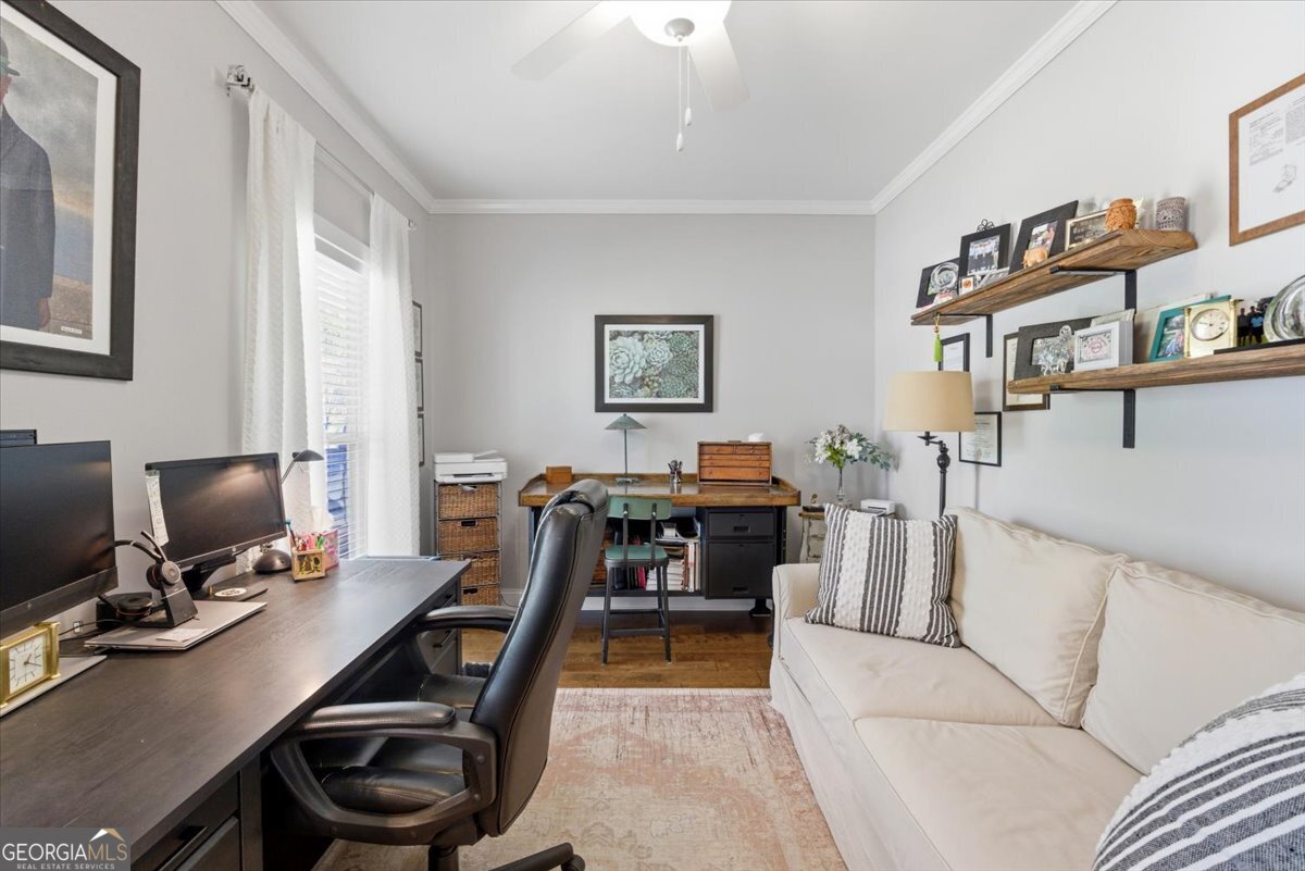 731 Markhams Drive Madison, GA 30650 - Photo 38 of 68 a view of a livingroom with workspace and a window