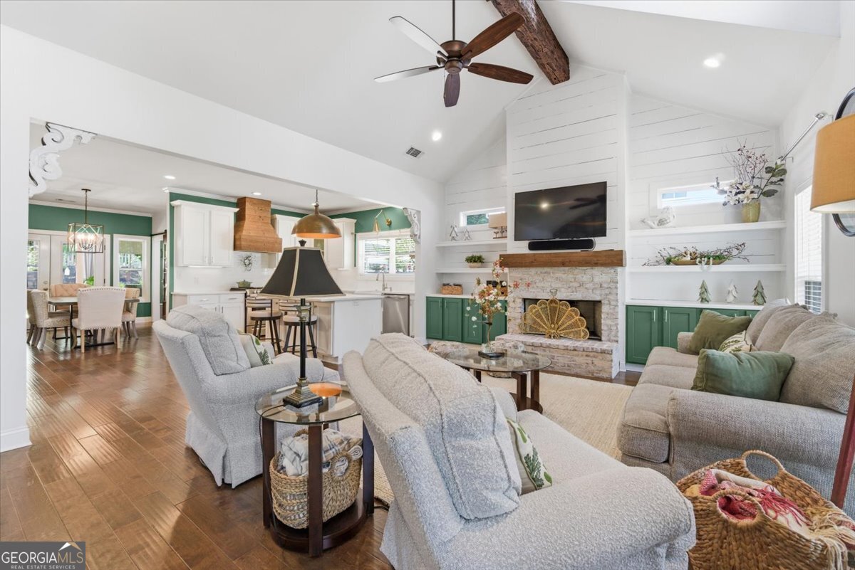 731 Markhams Drive Madison, GA 30650 - Photo 4 of 68 a living room with fireplace furniture and a flat screen tv
