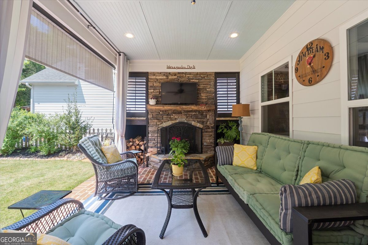 731 Markhams Drive Madison, GA 30650 - Photo 45 of 68 a view of a livingroom with furniture and a fireplace