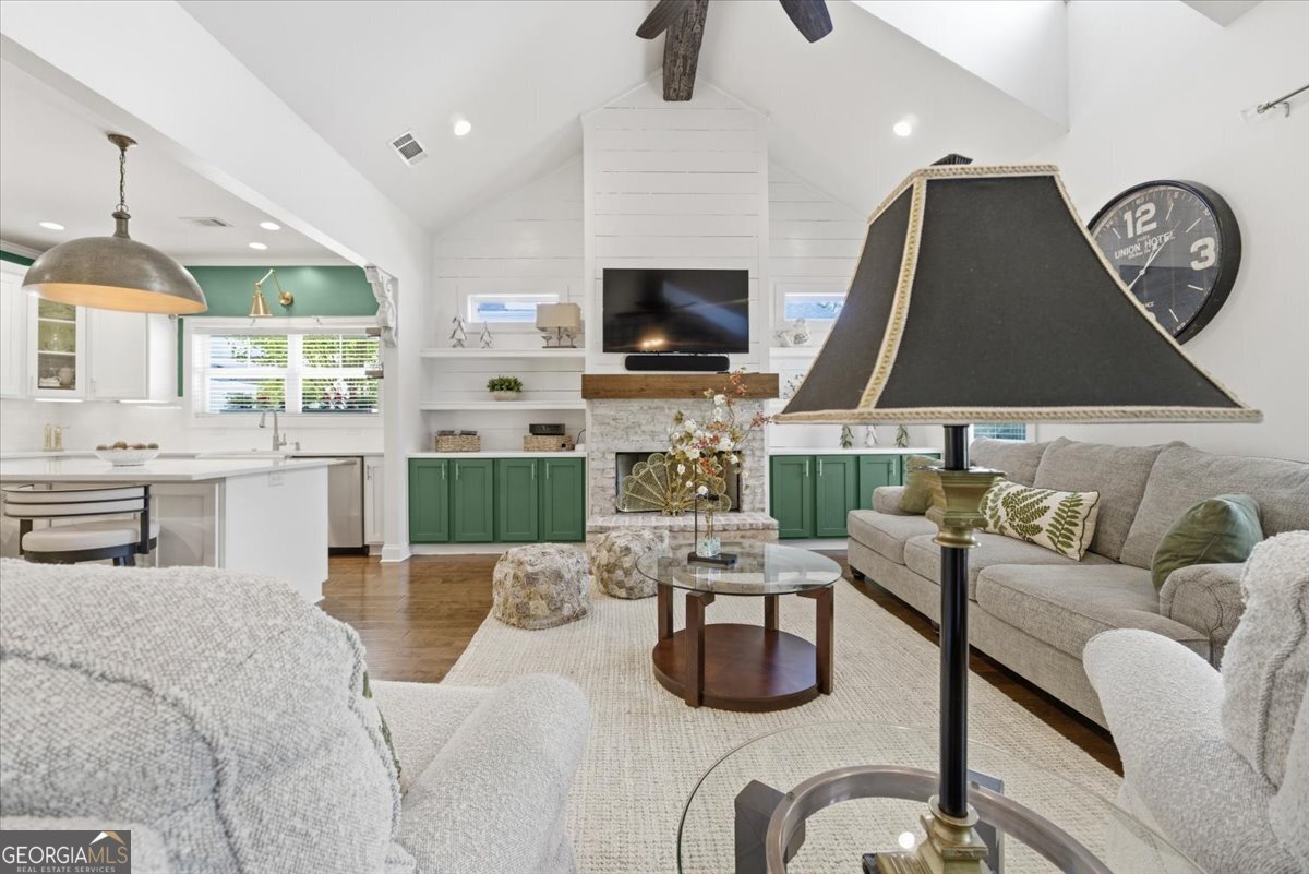 731 Markhams Drive Madison, GA 30650 - Photo 5 of 68 a living room with fireplace furniture and a flat screen tv