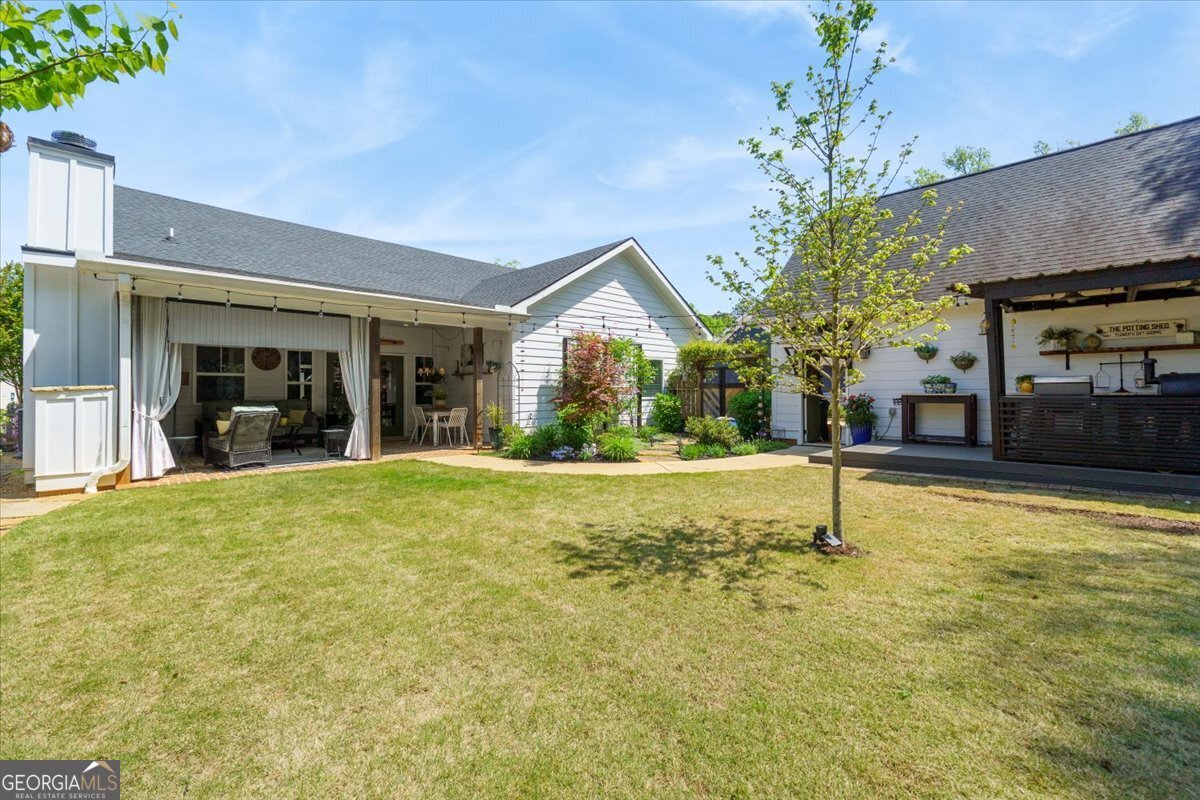731 Markhams Drive Madison, GA 30650 - Photo 52 of 68 a view of a house with a swimming pool