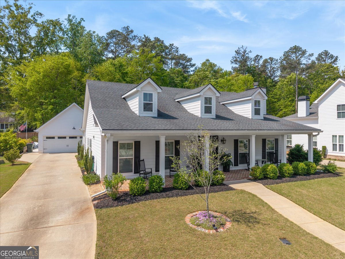 731 Markhams Drive Madison, GA 30650 - Photo 59 of 68 a front view of a house with a yard