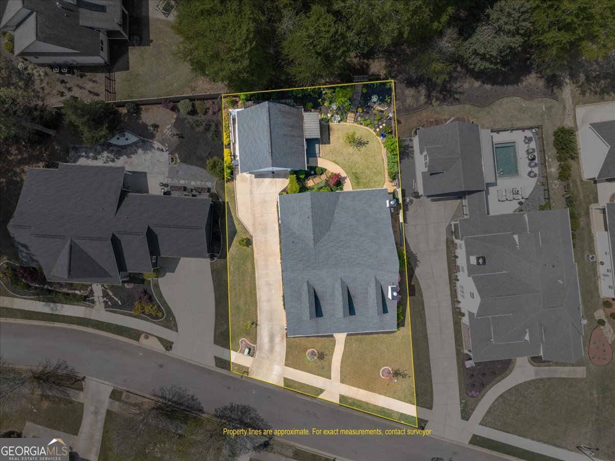 731 Markhams Drive Madison, GA 30650 - Photo 61 of 68 an aerial view of residential house with outdoor space and parking