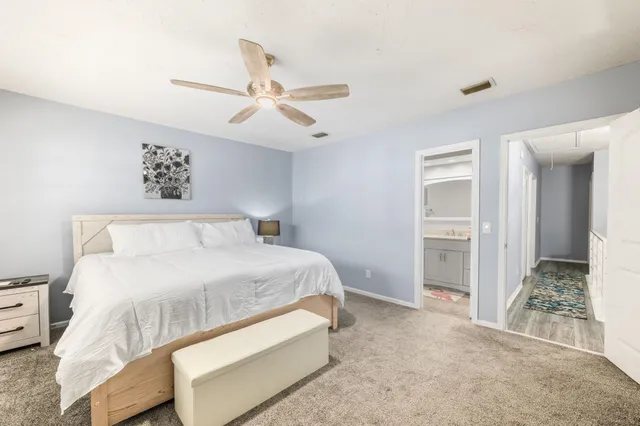 a bathroom with a sink toilet a mirror and shower