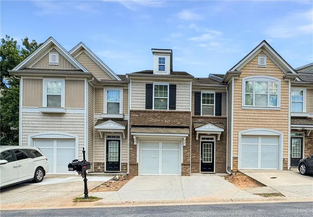 a view of a house with a street