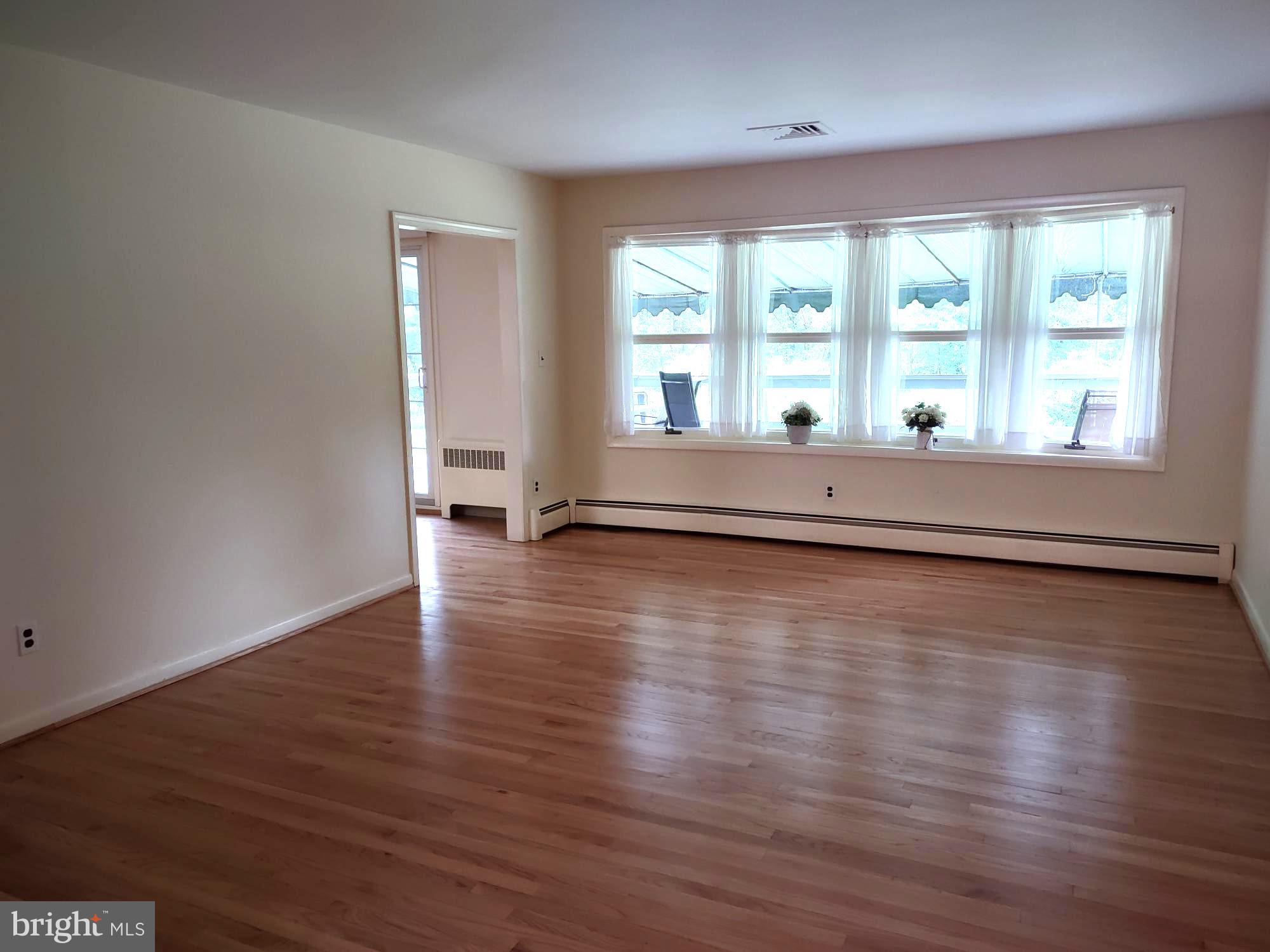 4103 Kincaid Road Baldwin, MD 21013 - Photo 11 of 73 a view of empty room with wooden floor and fan