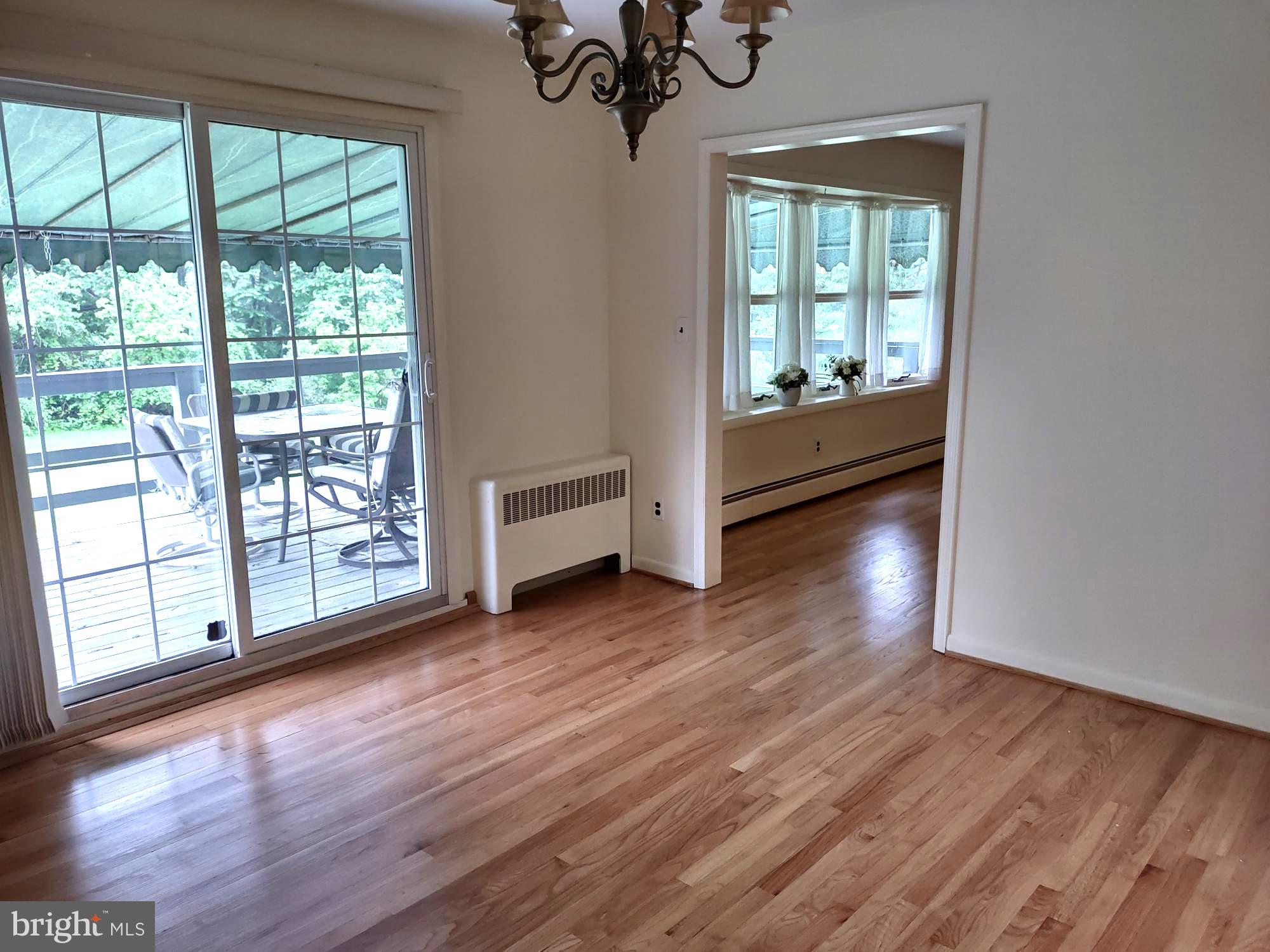 4103 Kincaid Road Baldwin, MD 21013 - Photo 18 of 73 a view of an empty room with wooden floor and a window