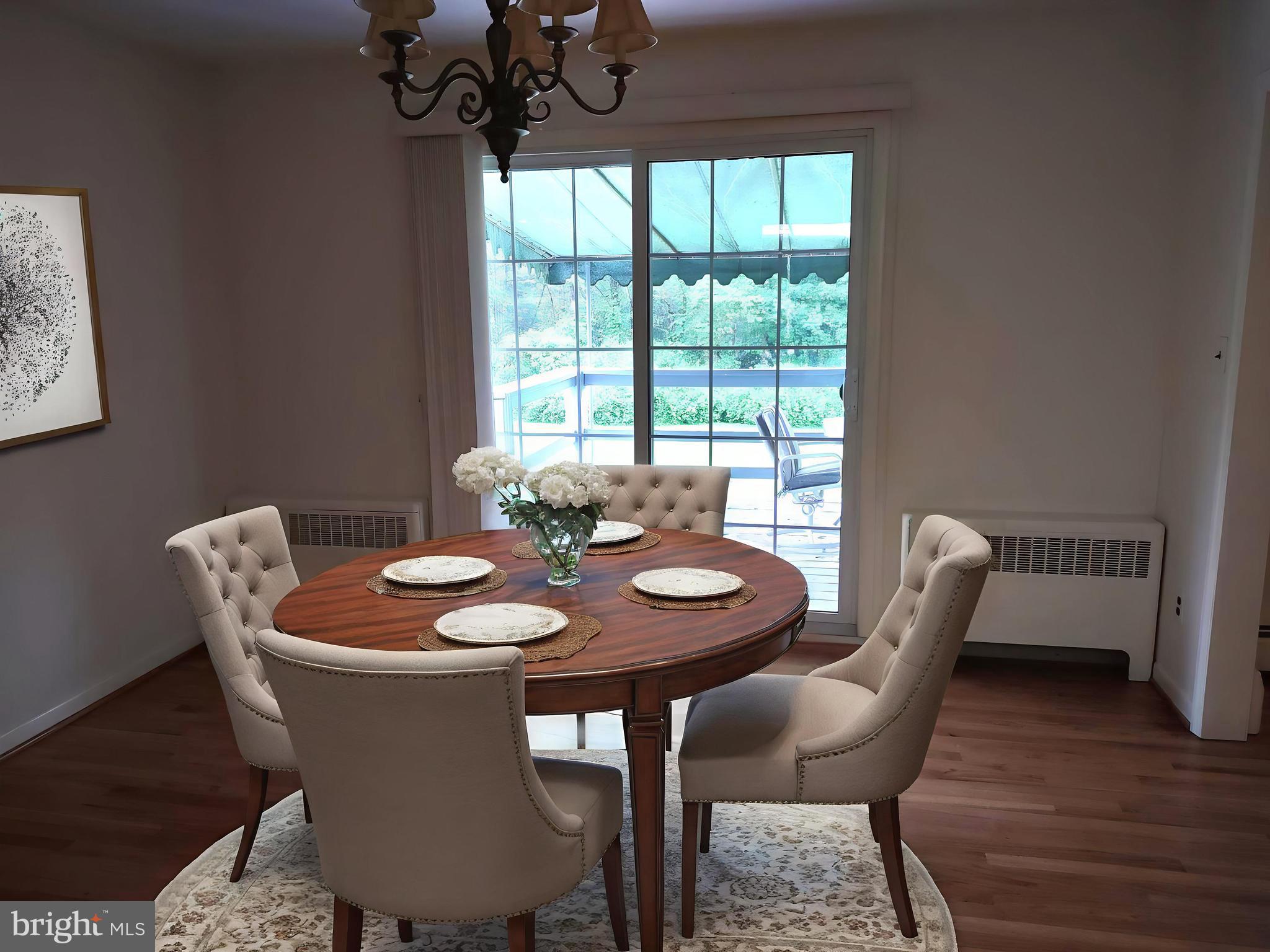 4103 Kincaid Road Baldwin, MD 21013 - Photo 20 of 73 a dining room with furniture a rug and wooden floor