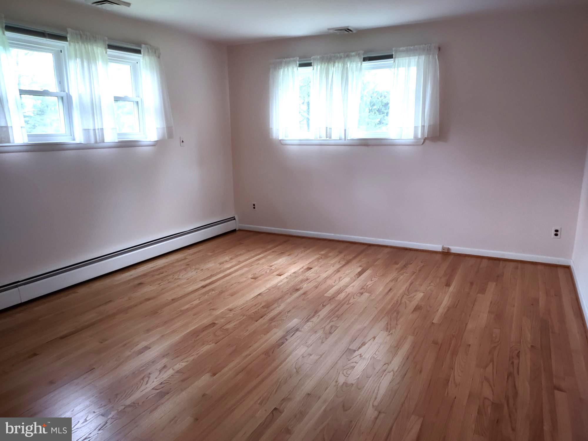 4103 Kincaid Road Baldwin, MD 21013 - Photo 34 of 73 an empty room with wooden floor and windows