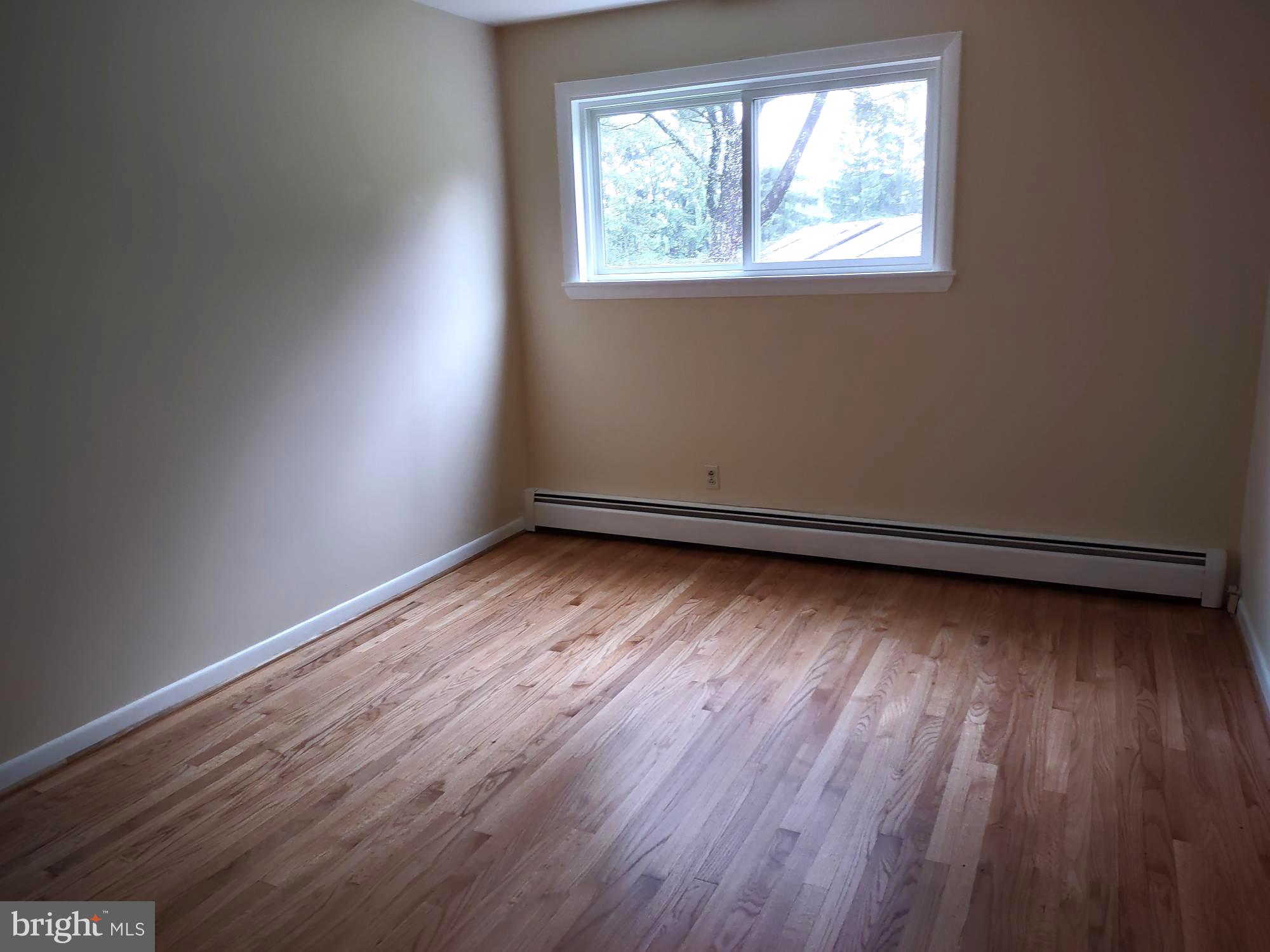 4103 Kincaid Road Baldwin, MD 21013 - Photo 41 of 73 an empty room with wooden floor and windows