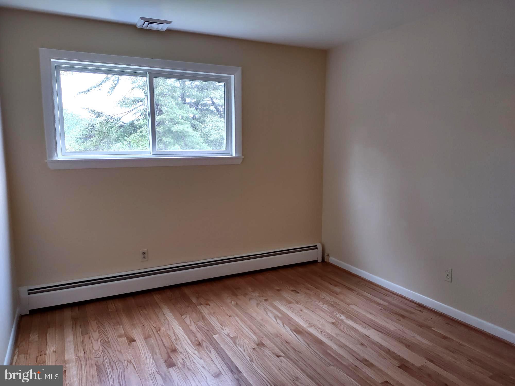 4103 Kincaid Road Baldwin, MD 21013 - Photo 42 of 73 an empty room with wooden floor and windows