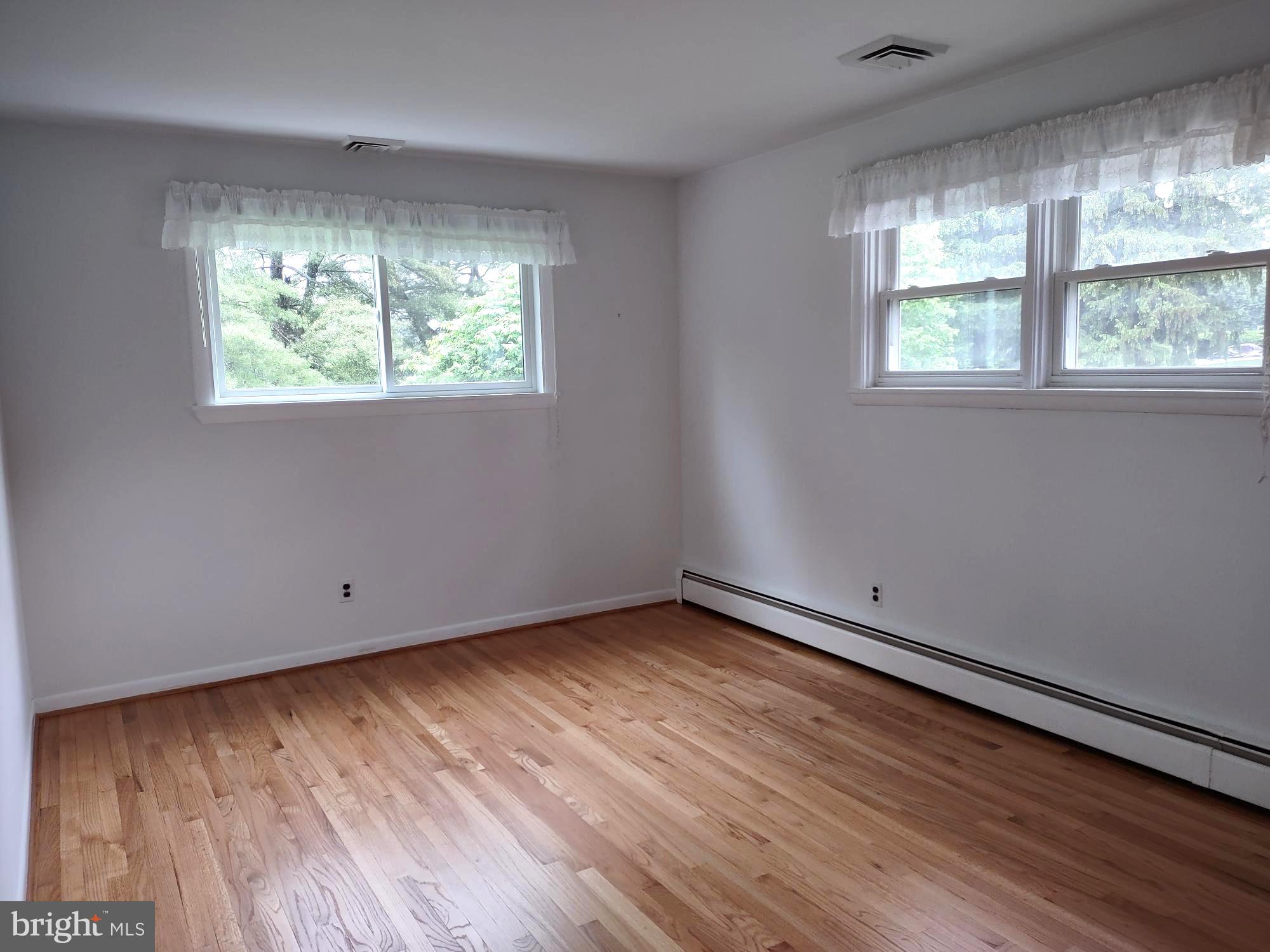 4103 Kincaid Road Baldwin, MD 21013 - Photo 44 of 73 an empty room with wooden floor and windows