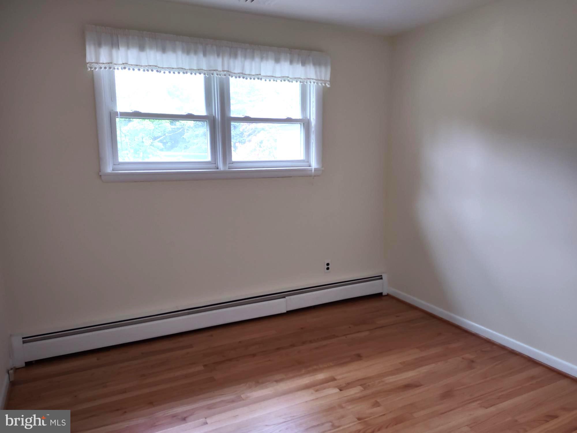 4103 Kincaid Road Baldwin, MD 21013 - Photo 48 of 73 an empty room with wooden floor and windows