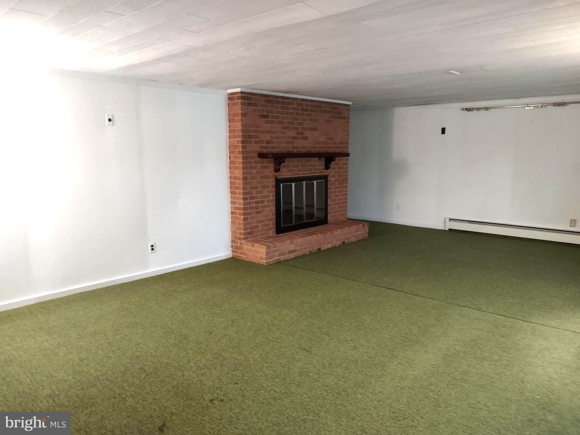 4103 Kincaid Road Baldwin, MD 21013 - Photo 53 of 73 a view of an empty room with a fireplace