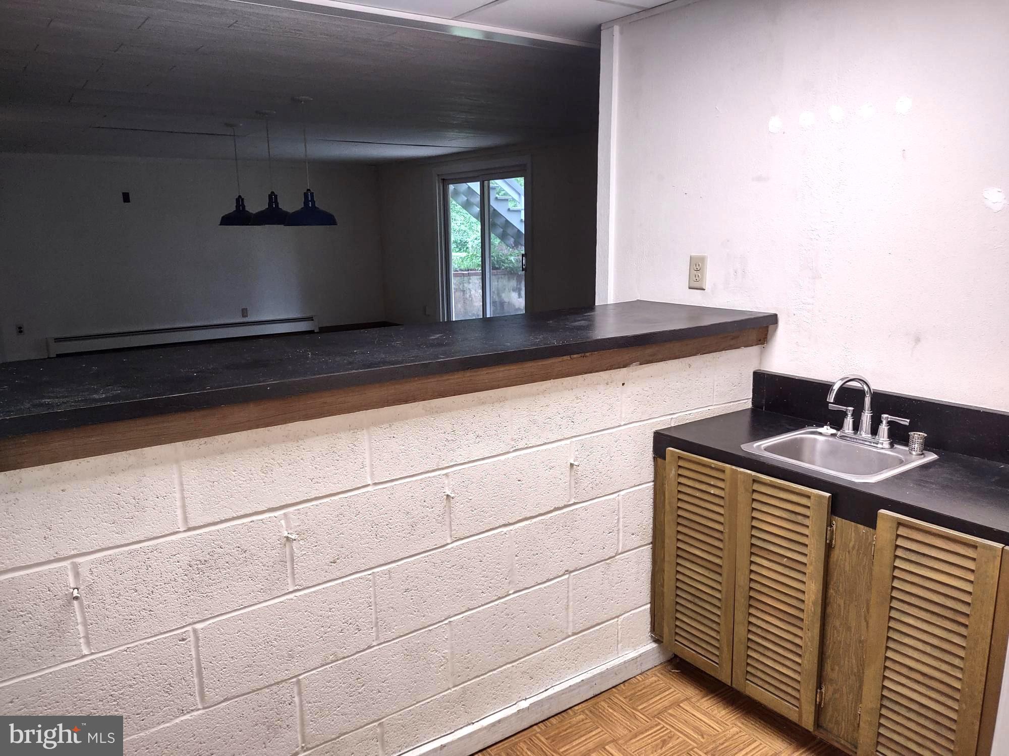 4103 Kincaid Road Baldwin, MD 21013 - Photo 62 of 73 a kitchen with a sink and a mirror