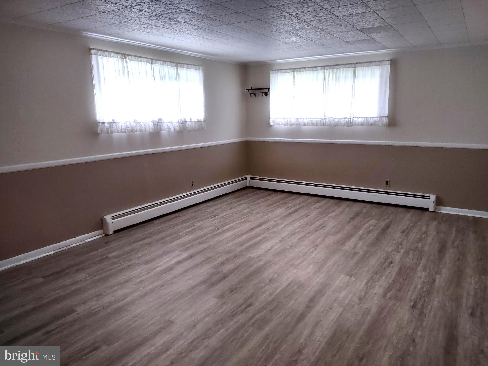 4103 Kincaid Road Baldwin, MD 21013 - Photo 63 of 73 an empty room with wooden floor and windows