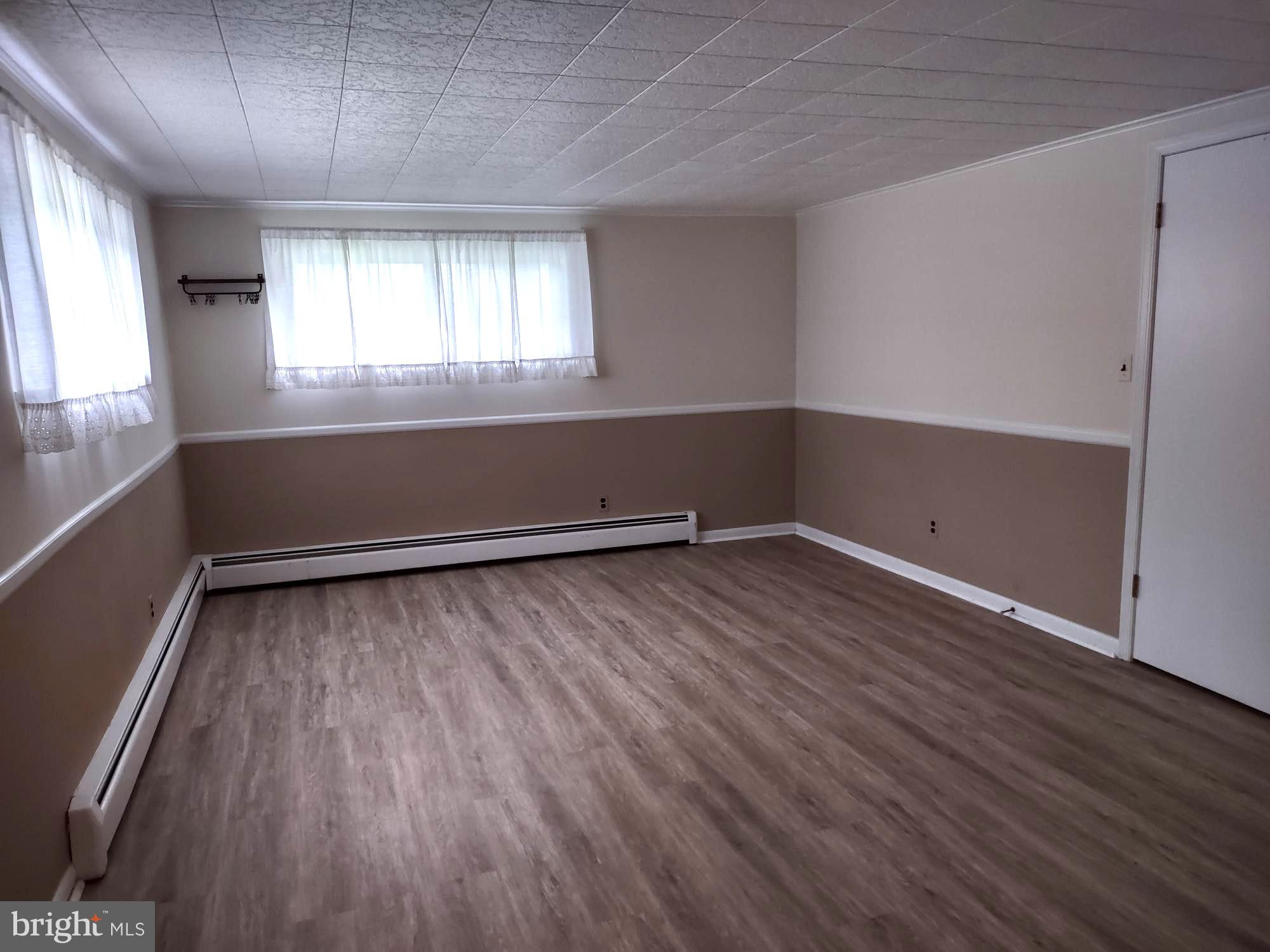 4103 Kincaid Road Baldwin, MD 21013 - Photo 64 of 73 an empty room with wooden floor and windows