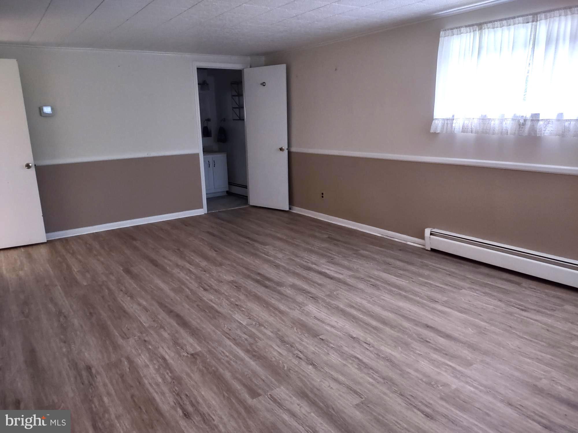 4103 Kincaid Road Baldwin, MD 21013 - Photo 65 of 73 wooden floor in an empty room with a window