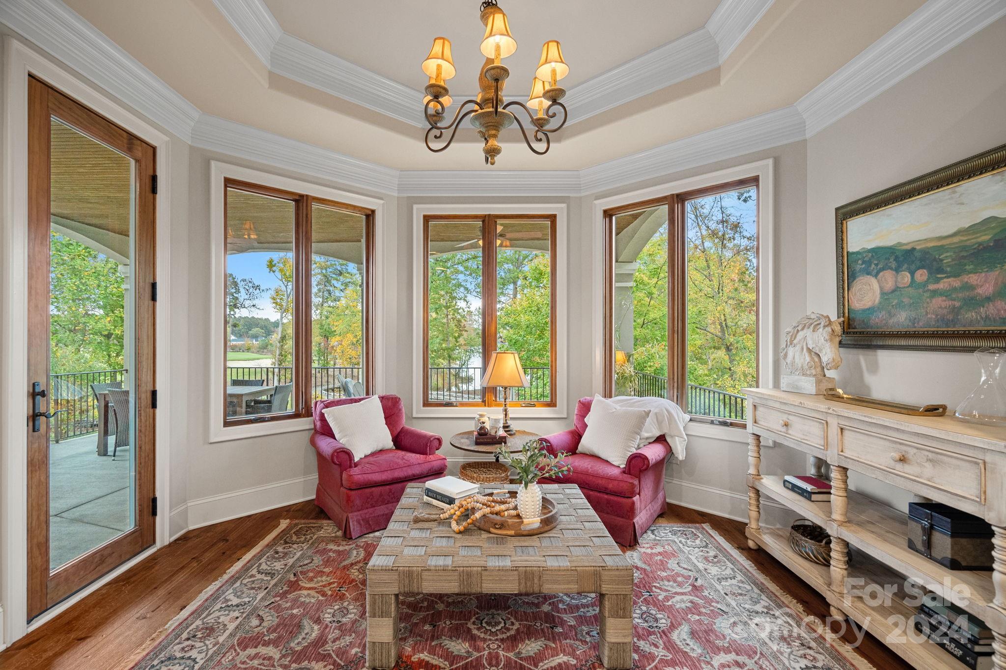 2017 Brawley School Road Mooresville, NC 28117 - Photo 14 of 43 a living room with furniture and a floor to ceiling window