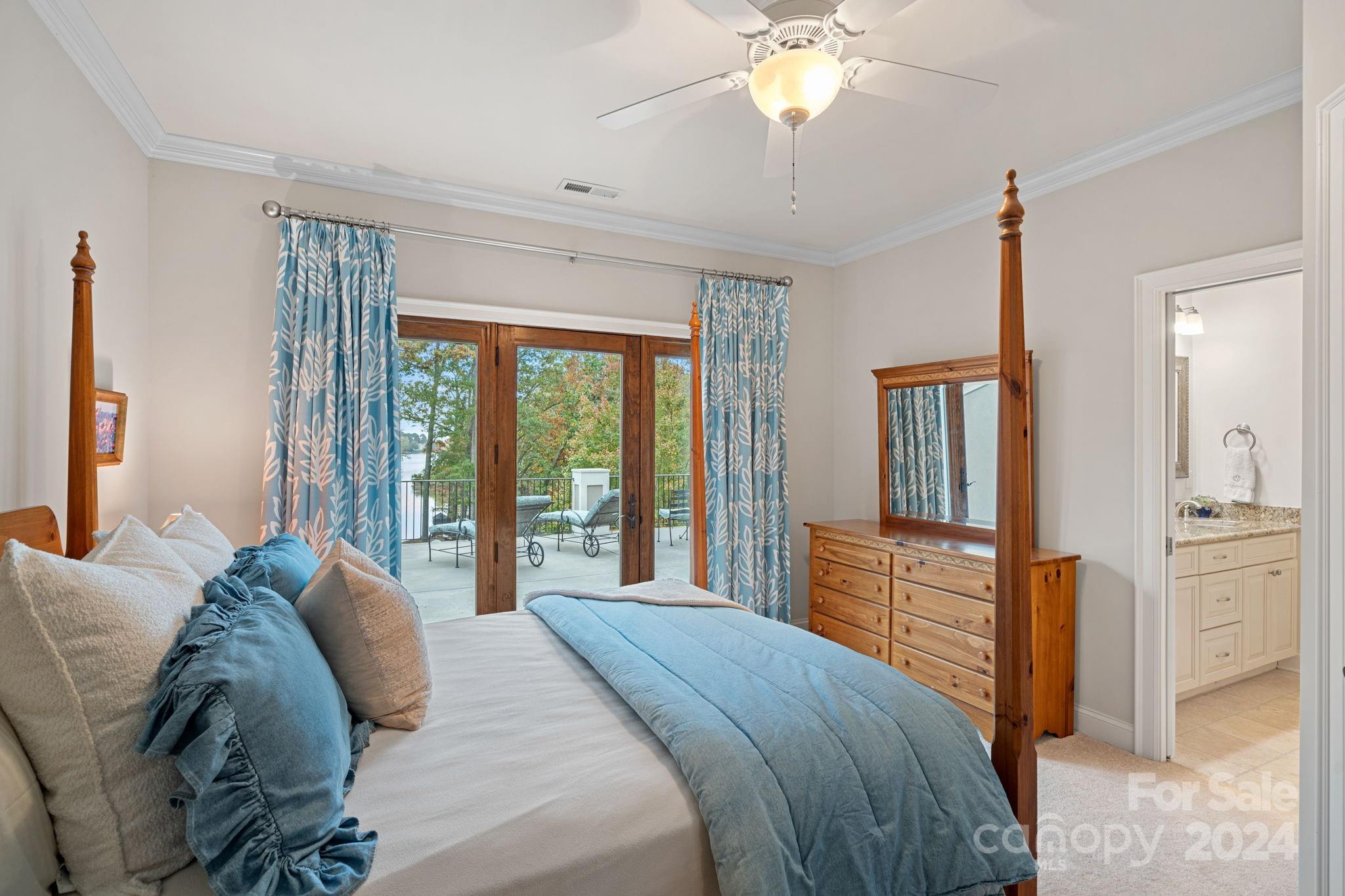 2017 Brawley School Road Mooresville, NC 28117 - Photo 20 of 43 a bedroom with a large bed and flat tv