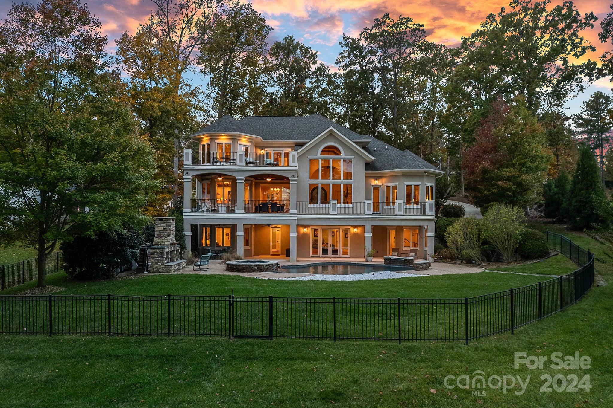 2017 Brawley School Road Mooresville, NC 28117 - Photo 2 of 43 a front view of a house with a yard table and chairs