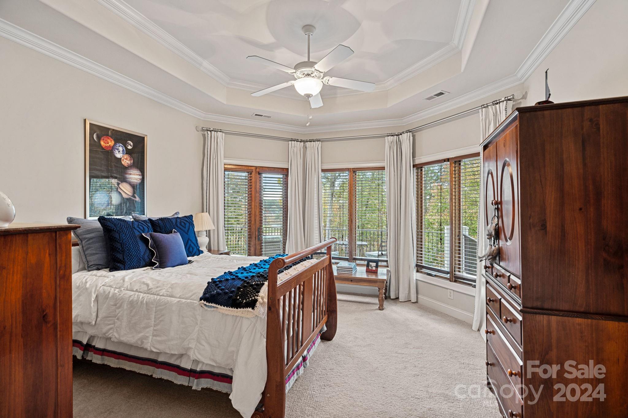 2017 Brawley School Road Mooresville, NC 28117 - Photo 22 of 43 a bedroom with a bed couch and a large window