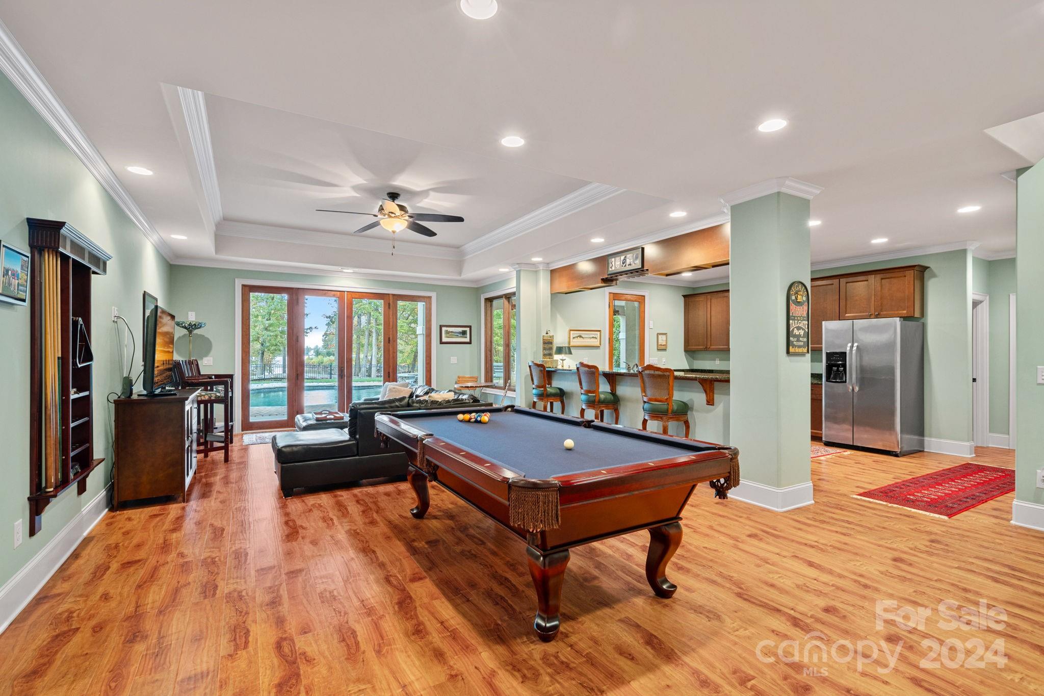 2017 Brawley School Road Mooresville, NC 28117 - Photo 25 of 43 a living room with stainless steel appliances kitchen island granite countertop furniture and a rug