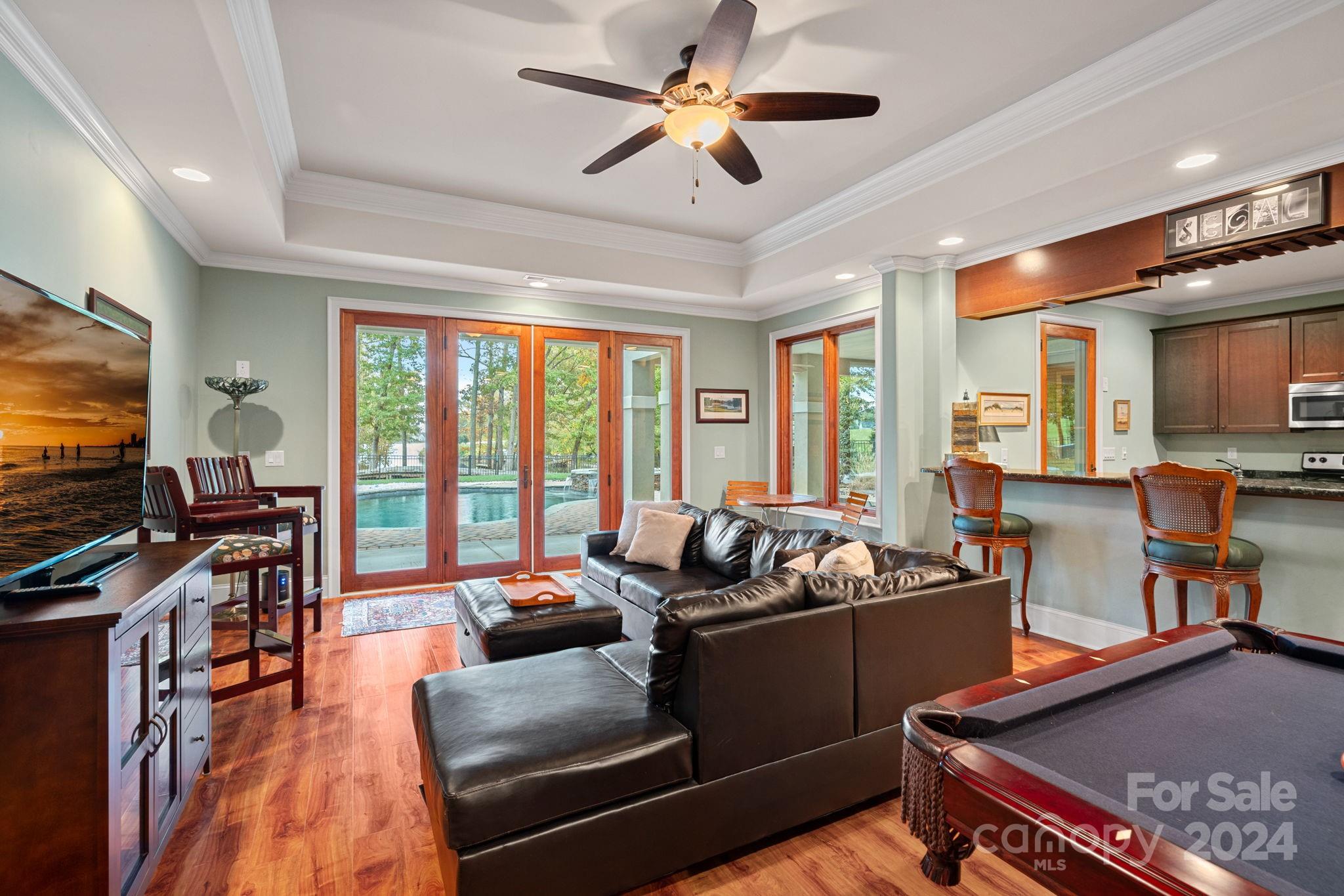 2017 Brawley School Road Mooresville, NC 28117 - Photo 26 of 43 a living room with fireplace furniture and a flat screen tv