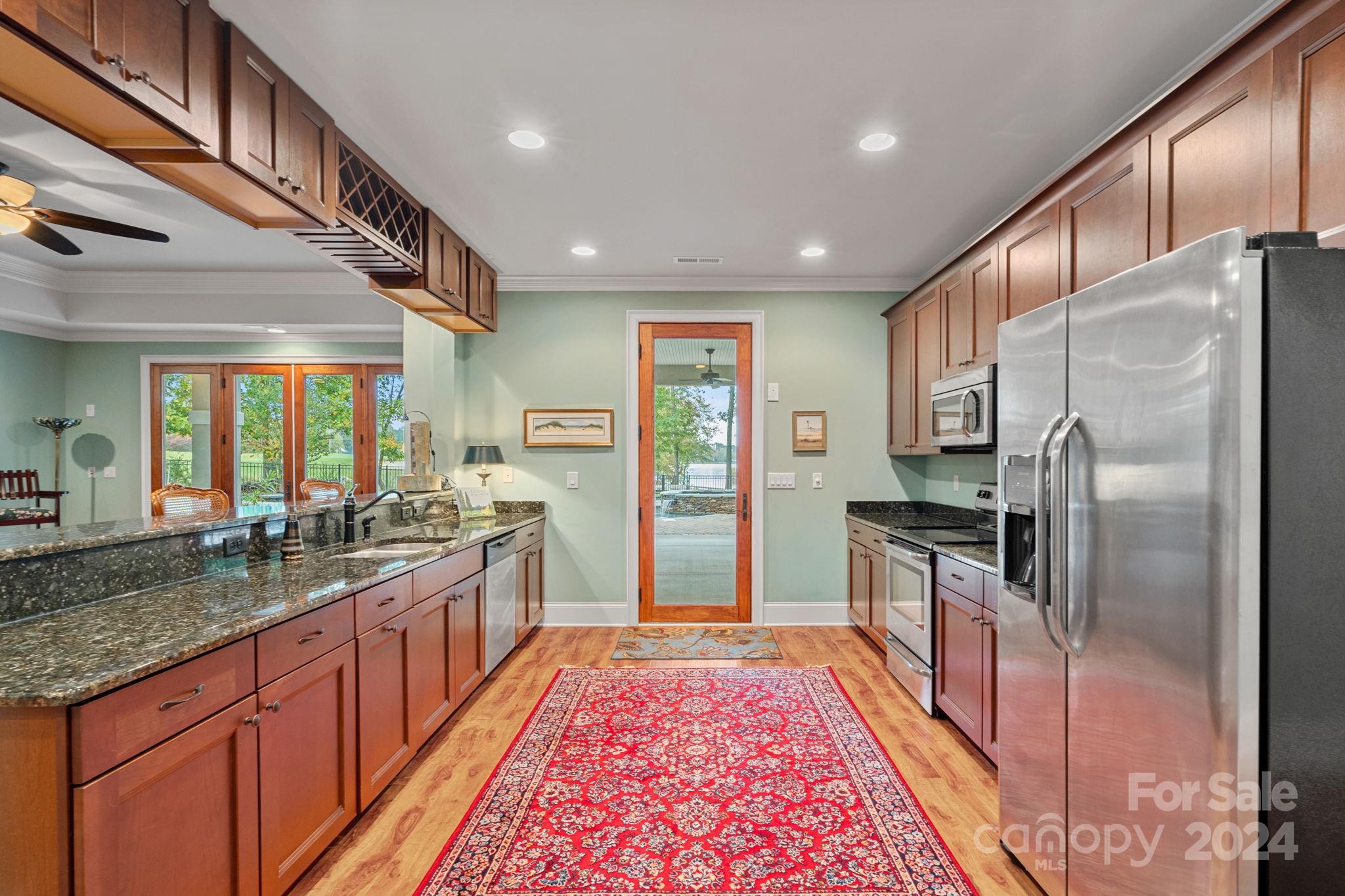 2017 Brawley School Road Mooresville, NC 28117 - Photo 27 of 43 a large kitchen with stainless steel appliances granite countertop a refrigerator and a sink