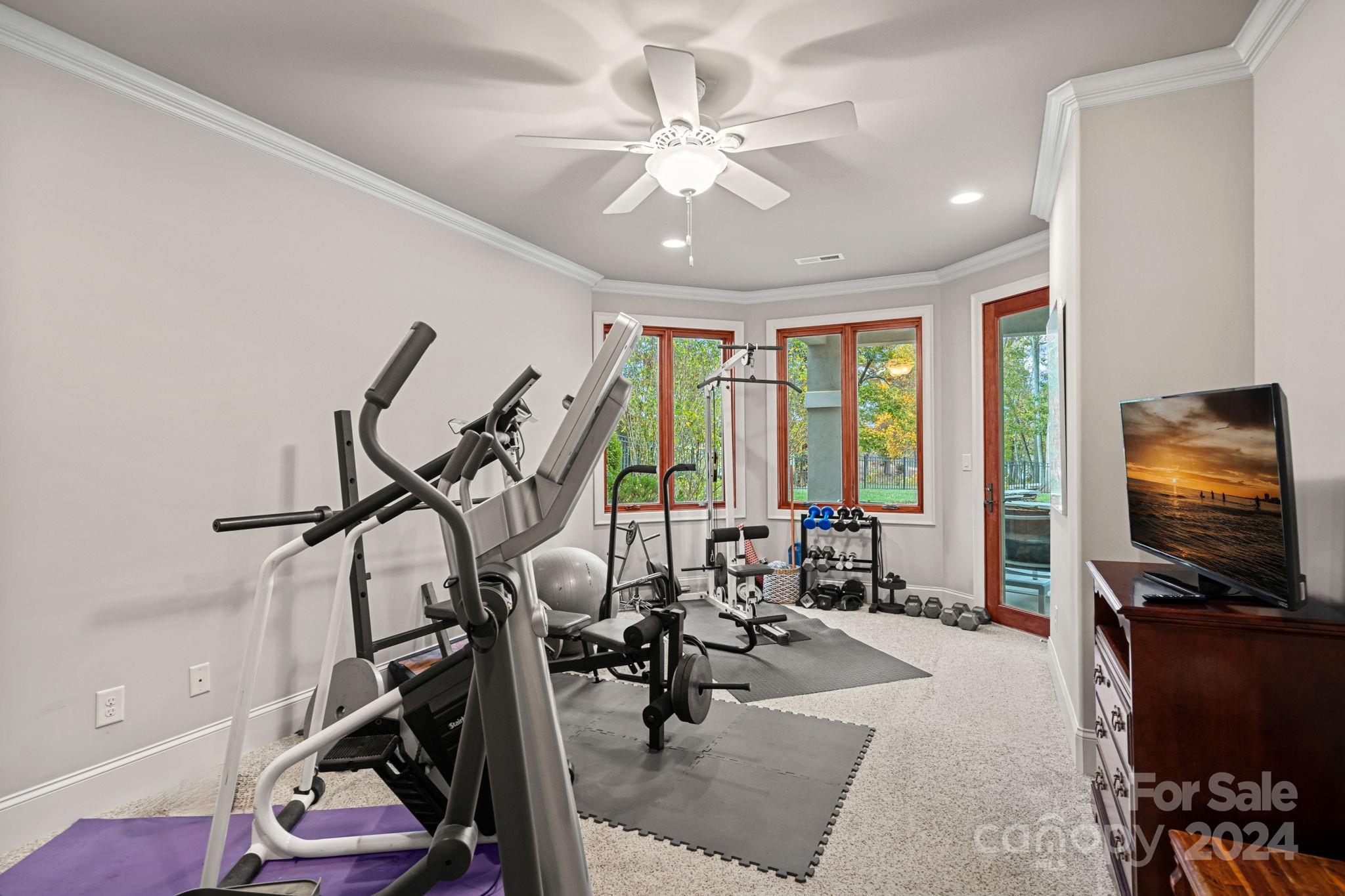 2017 Brawley School Road Mooresville, NC 28117 - Photo 30 of 43 a living room with furniture and a flat screen tv