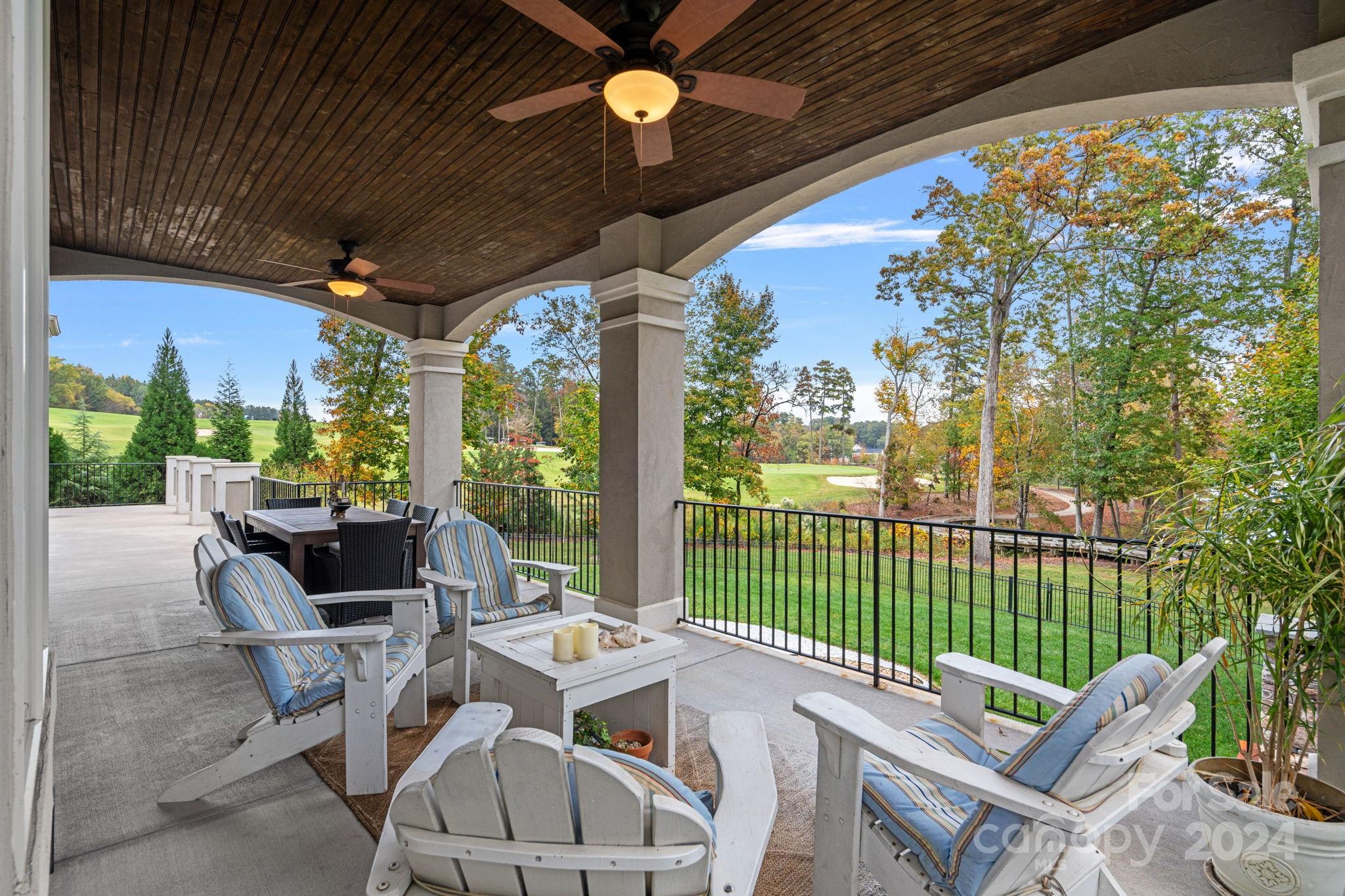 2017 Brawley School Road Mooresville, NC 28117 - Photo 32 of 43 a view of a patio with a table chairs and a backyard