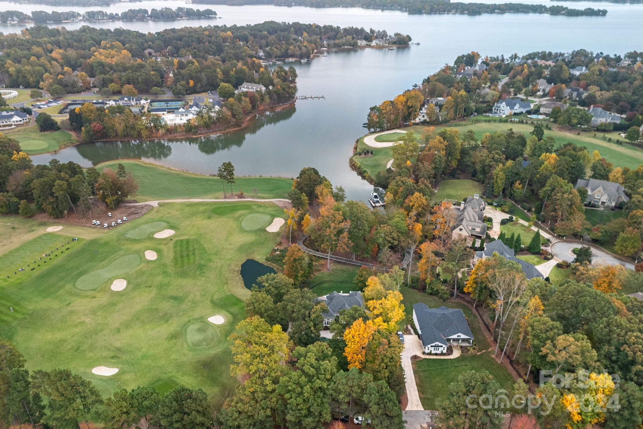 2017 Brawley School Road Mooresville, NC 28117 - Photo 34 of 43 an aerial view of residential houses with outdoor space and lake view