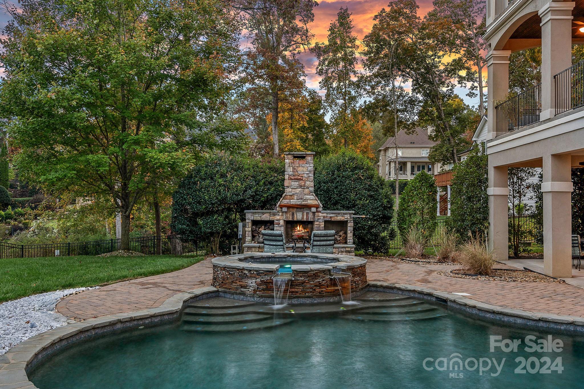 2017 Brawley School Road Mooresville, NC 28117 - Photo 37 of 43 a view of swimming pool with lawn chairs and plants