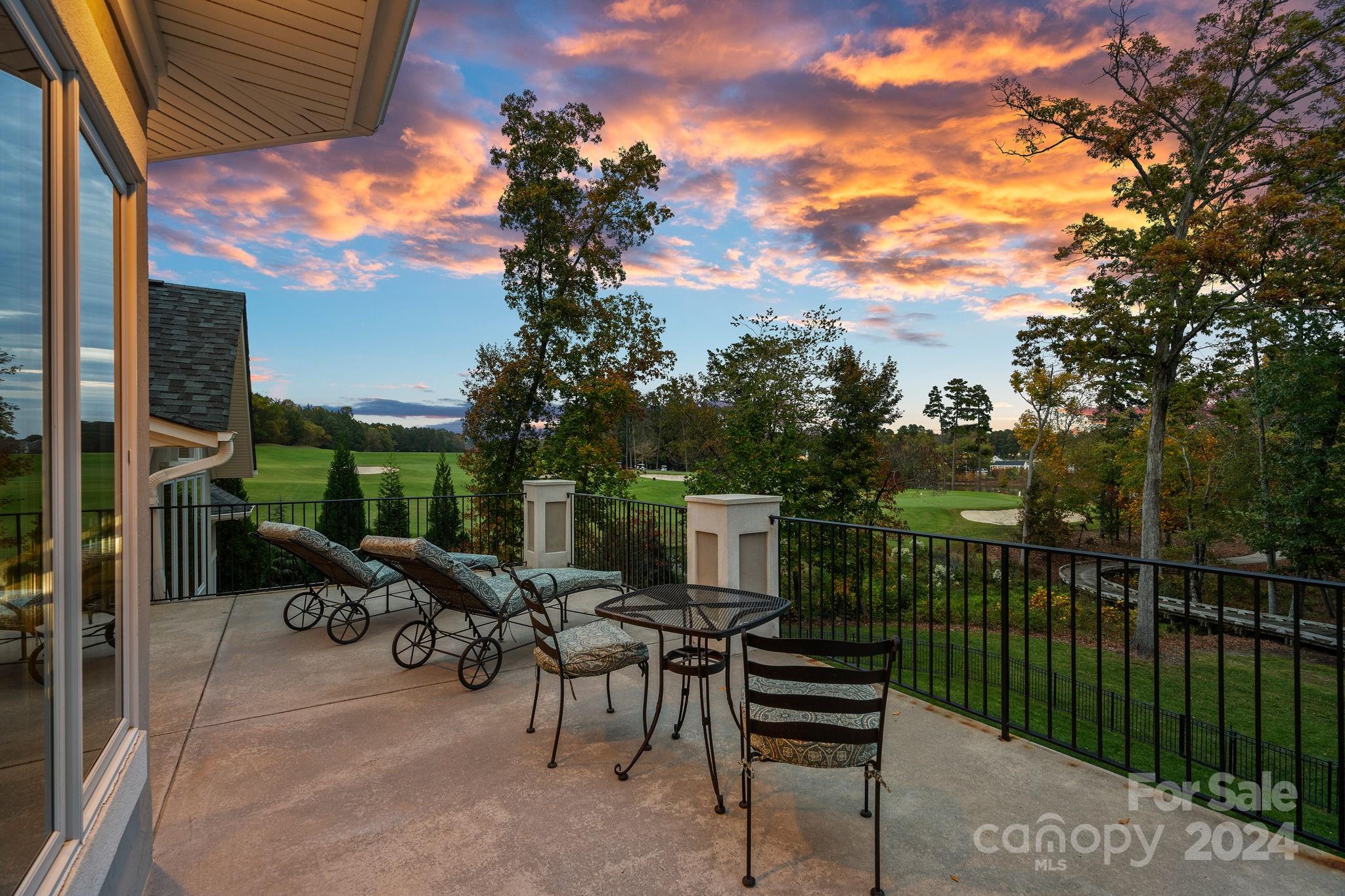 2017 Brawley School Road Mooresville, NC 28117 - Photo 4 of 43 a view of a patio with a table chairs and a backyard
