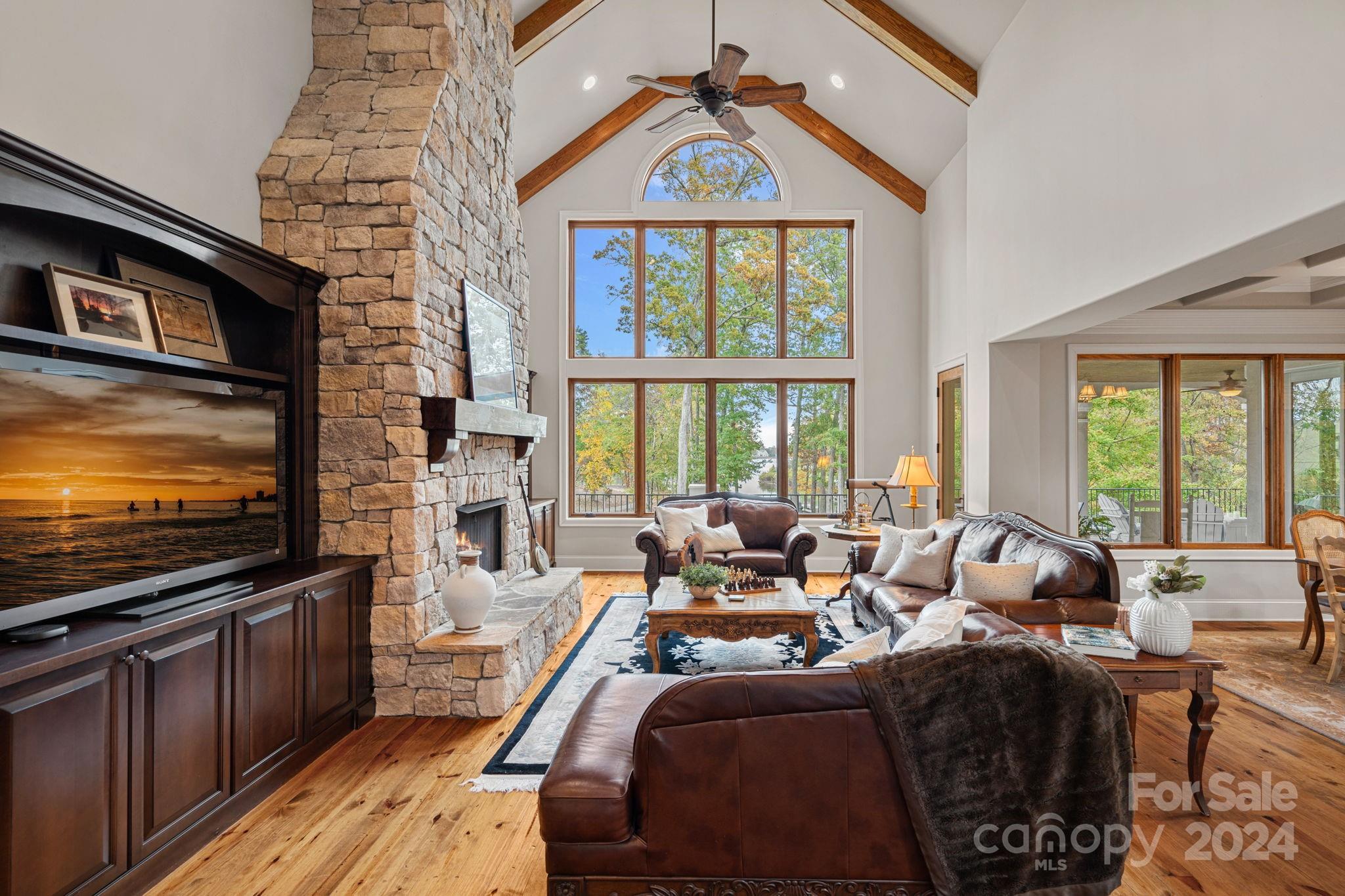 2017 Brawley School Road Mooresville, NC 28117 - Photo 8 of 43 a living room with furniture tv and a large window