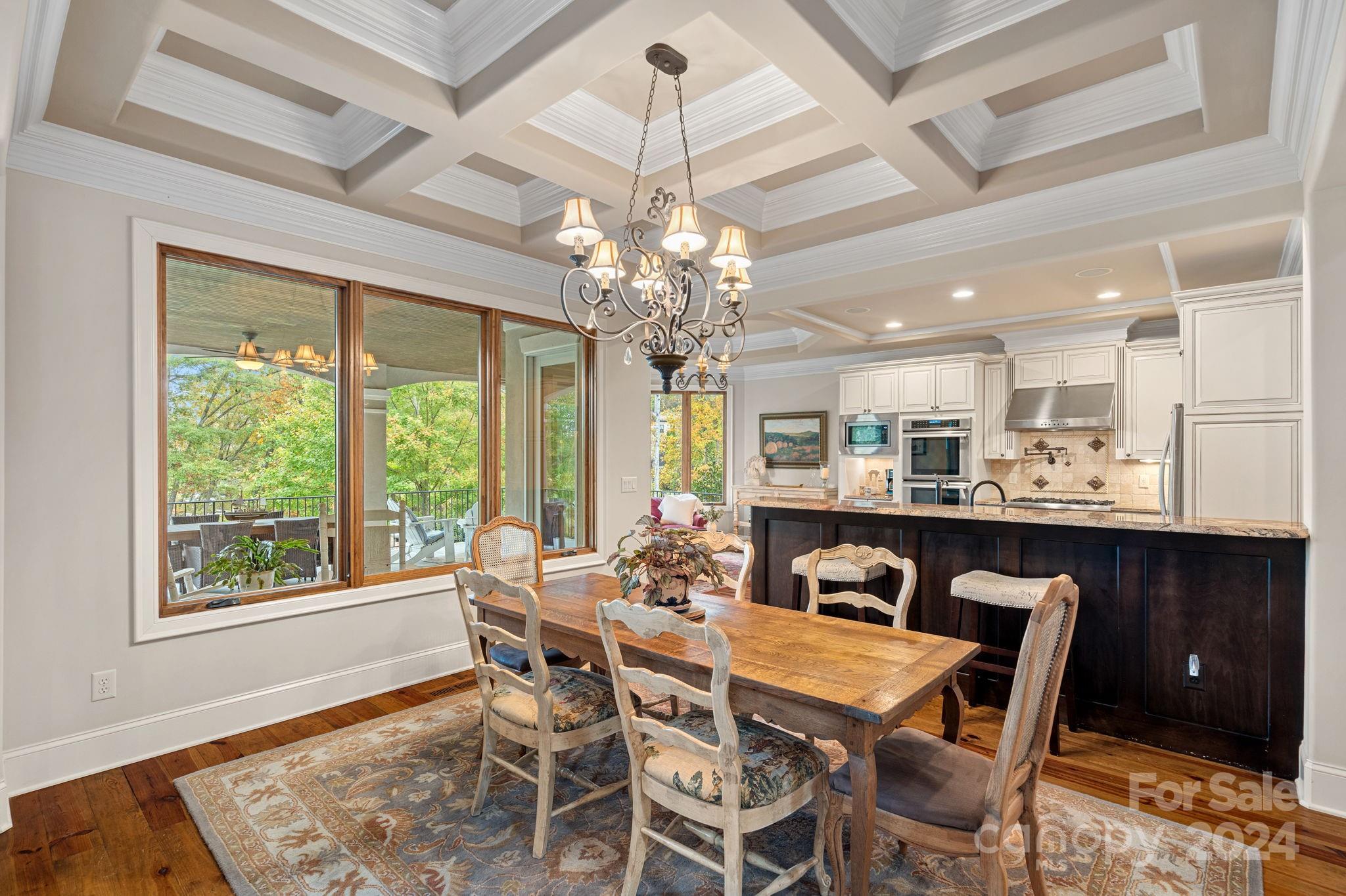 2017 Brawley School Road Mooresville, NC 28117 - Photo 10 of 43 a dining room with furniture a chandelier and window