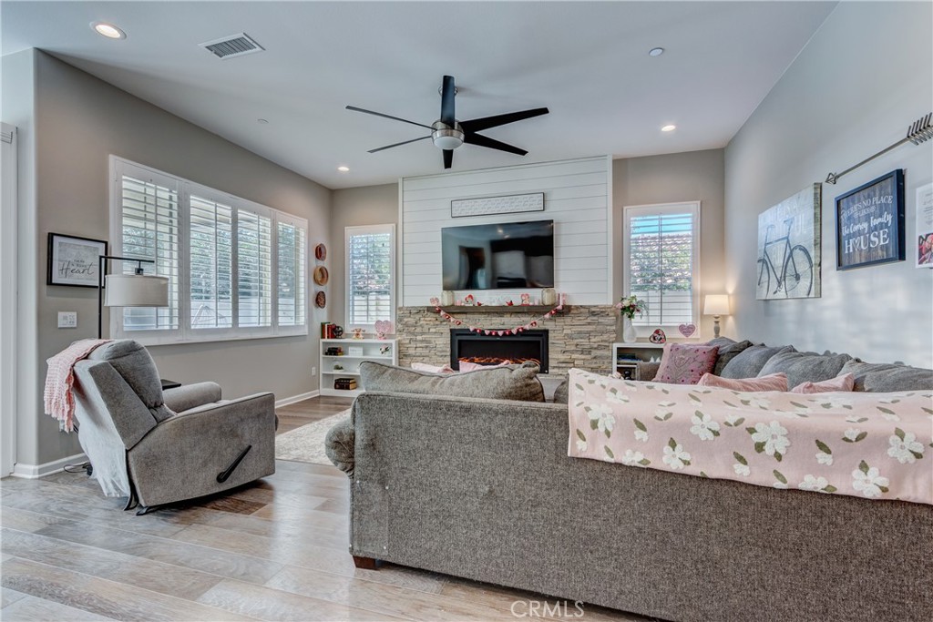 11137 Briar Rose Court Corona, CA 92883 - Photo 12 of 75 a living room with furniture fireplace and a flat screen tv