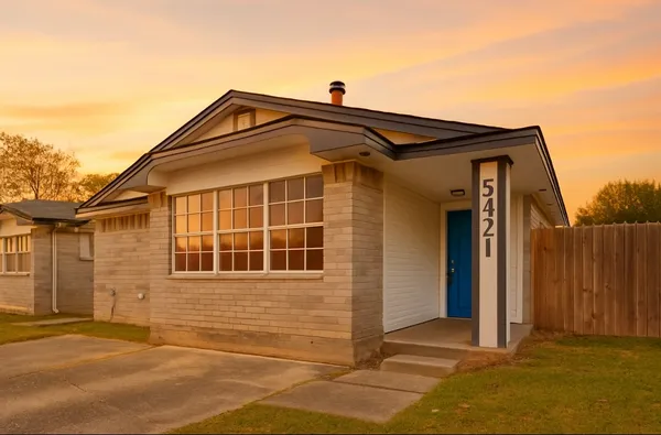 a front view of a house with a garage