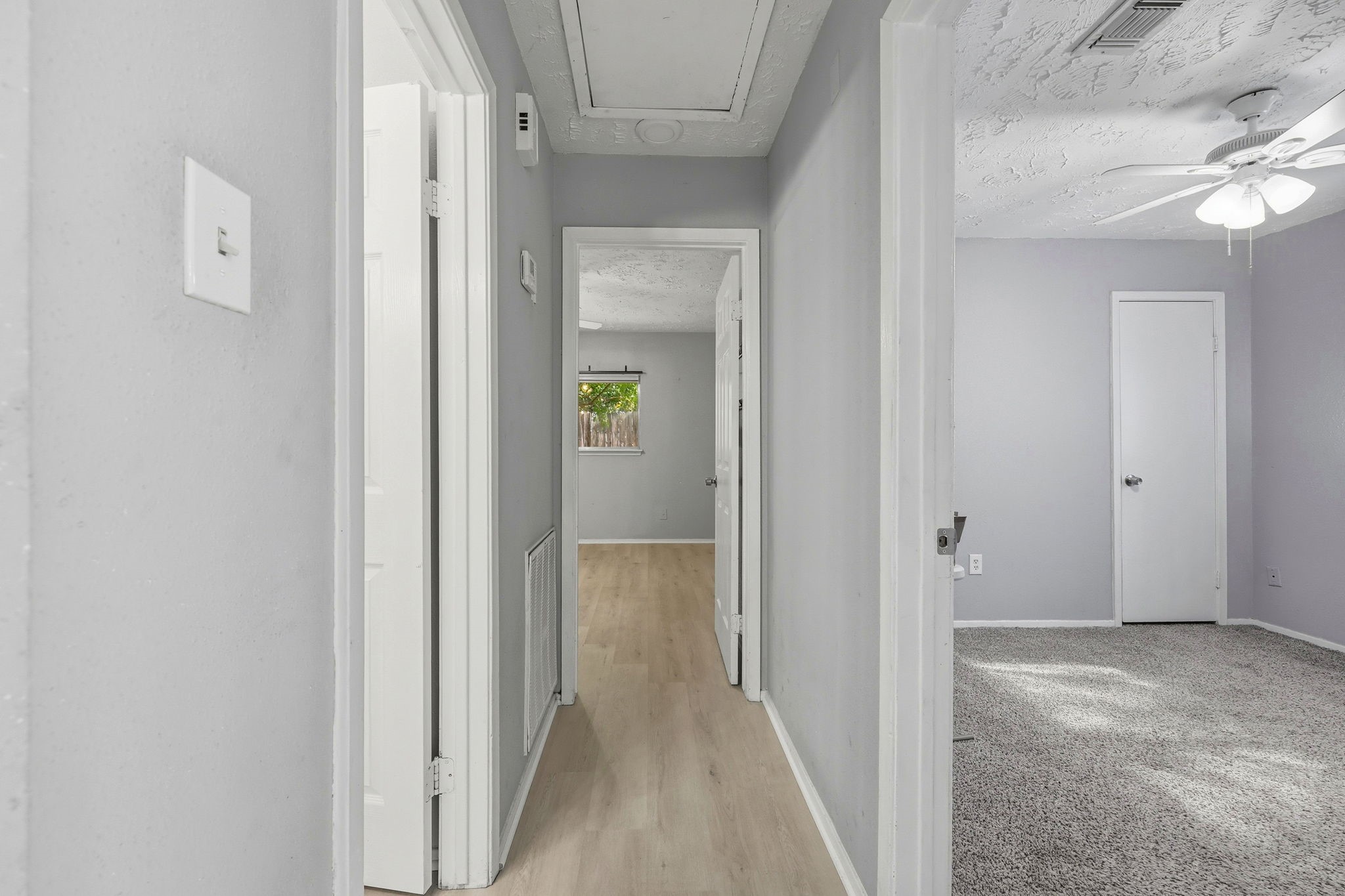 5421 Diane Court Spring, TX 77373 - Photo 13 of 24 a view of a hallway with wooden floor