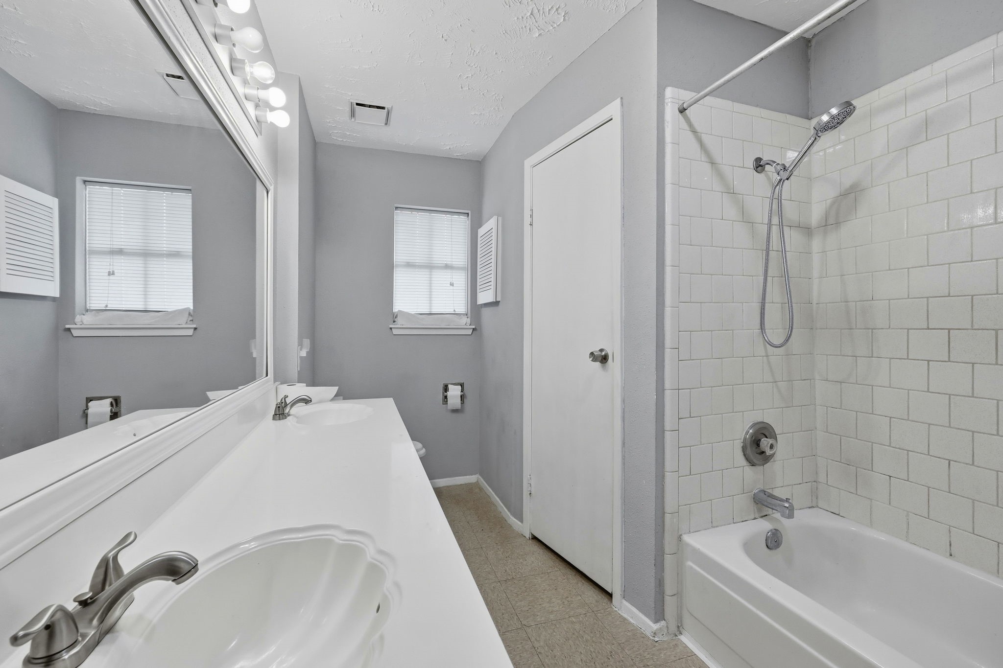 5421 Diane Court Spring, TX 77373 - Photo 16 of 24 a en suite bathroom with a tub shower sink and mirror