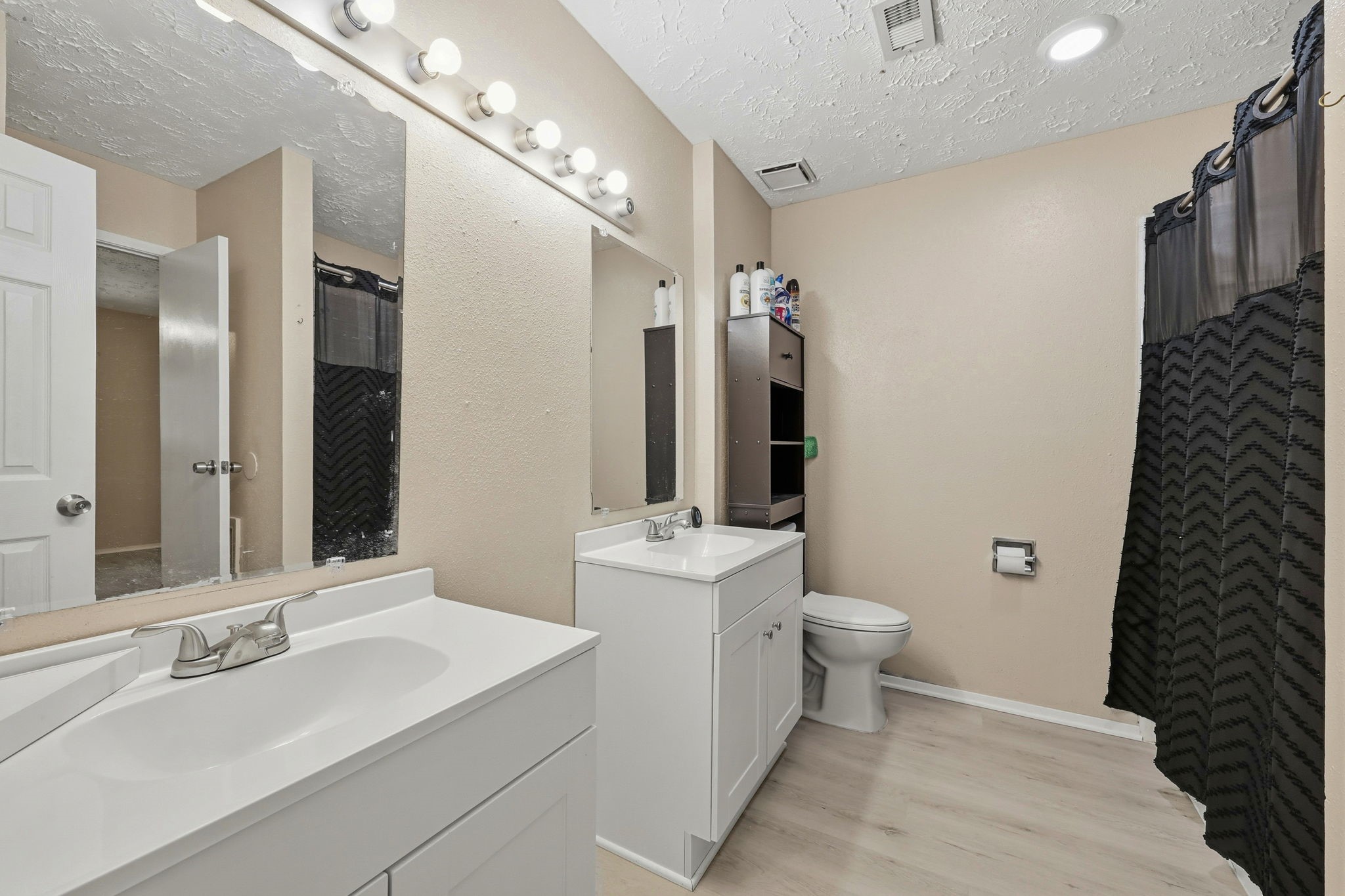 5421 Diane Court Spring, TX 77373 - Photo 18 of 24 a bathroom with a sink toilet and shower