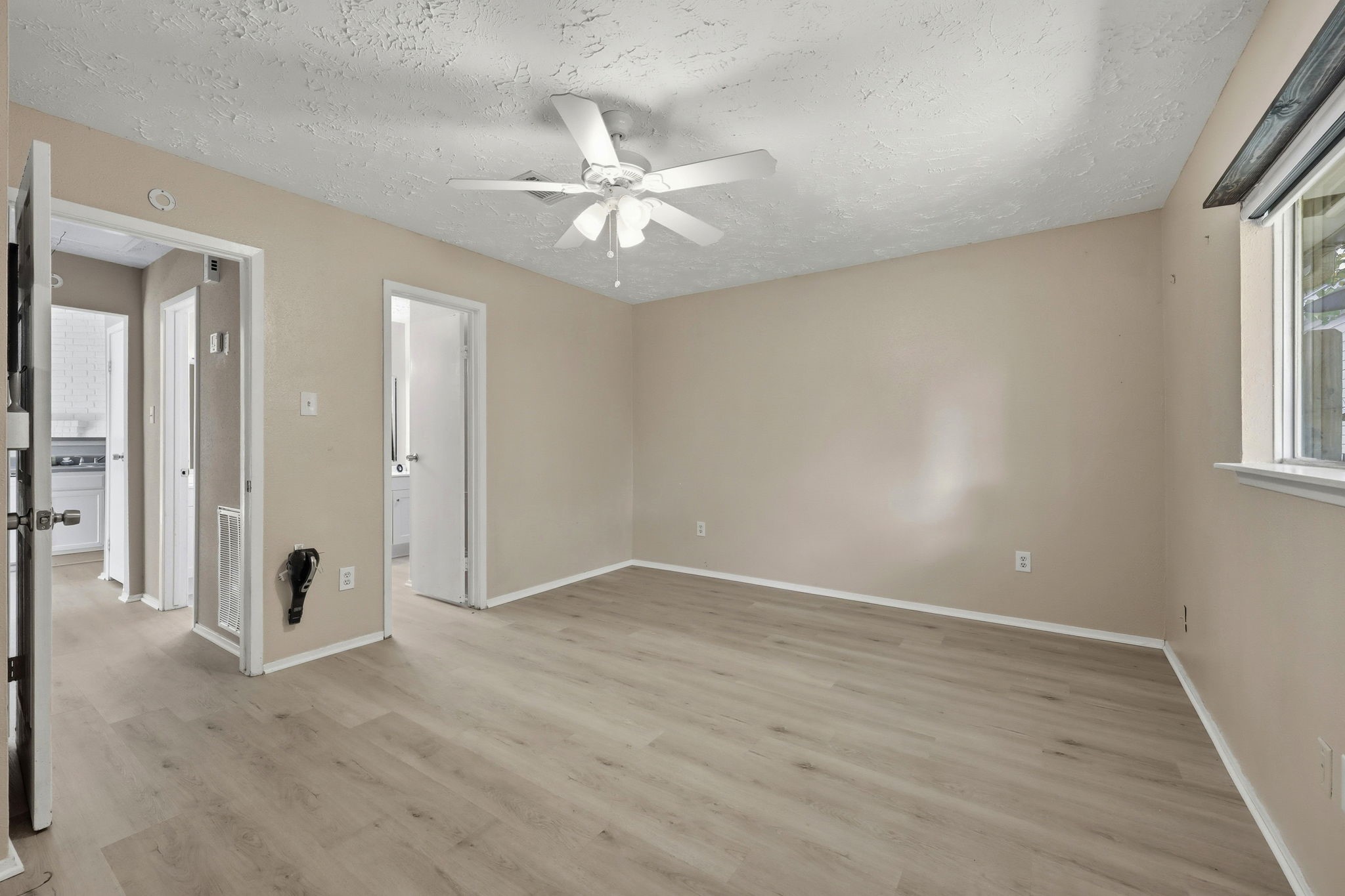 5421 Diane Court Spring, TX 77373 - Photo 20 of 24 an empty room with fan and windows