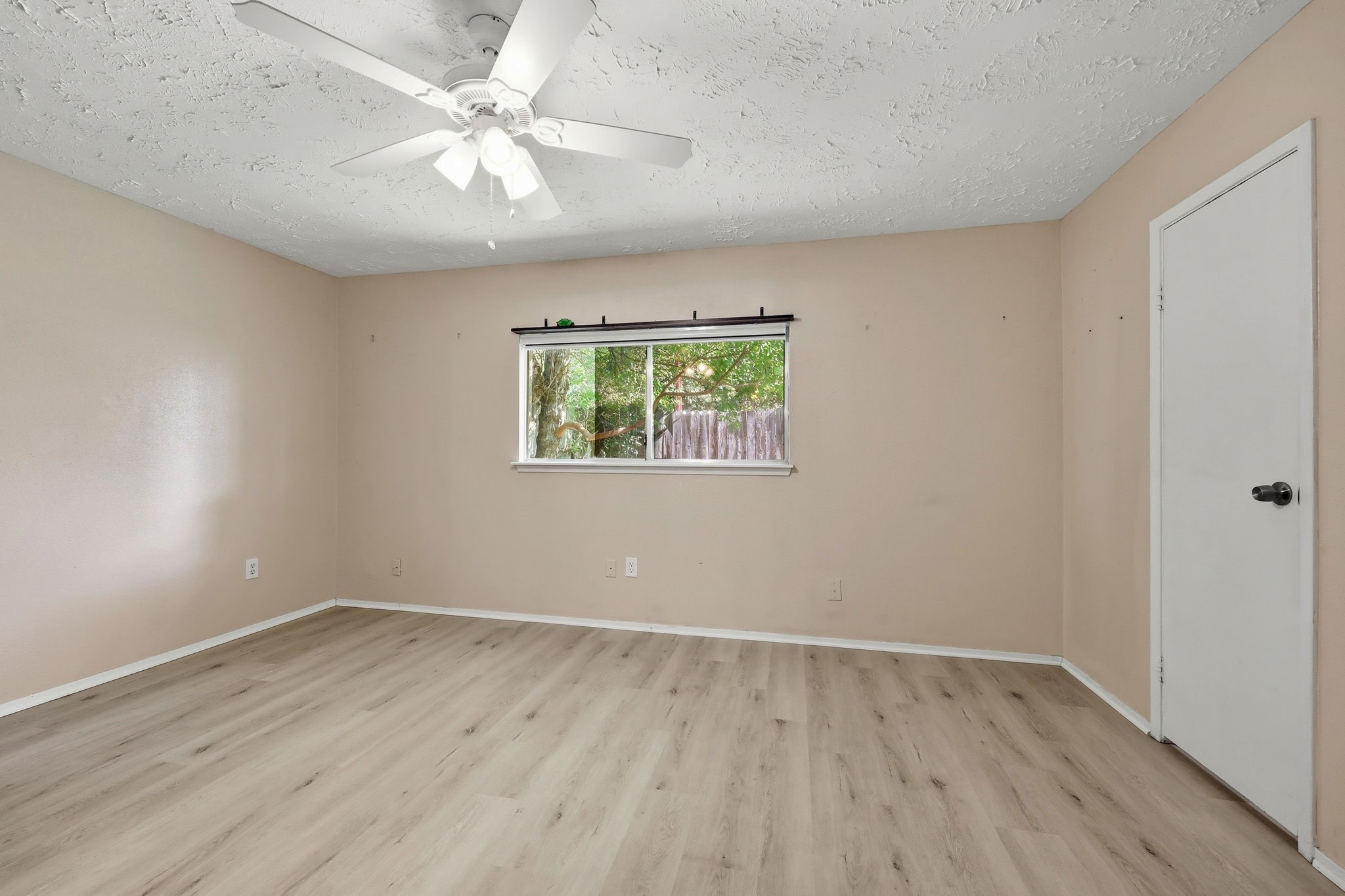 5421 Diane Court Spring, TX 77373 - Photo 21 of 24 wooden floor in an empty room with a window