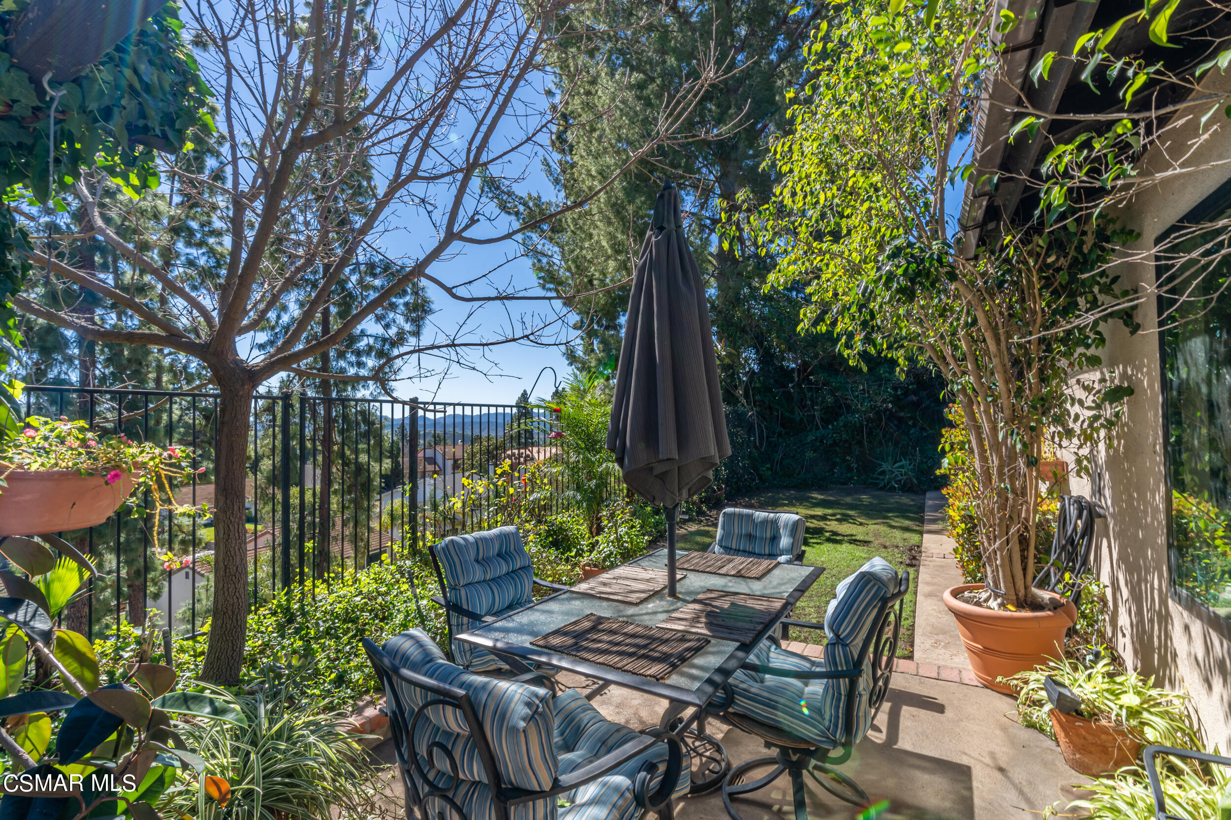 1932 Summer Cloud Drive Thousand Oaks, CA 91362 - Photo 21 of 23 a view of chair and tables in the backyard