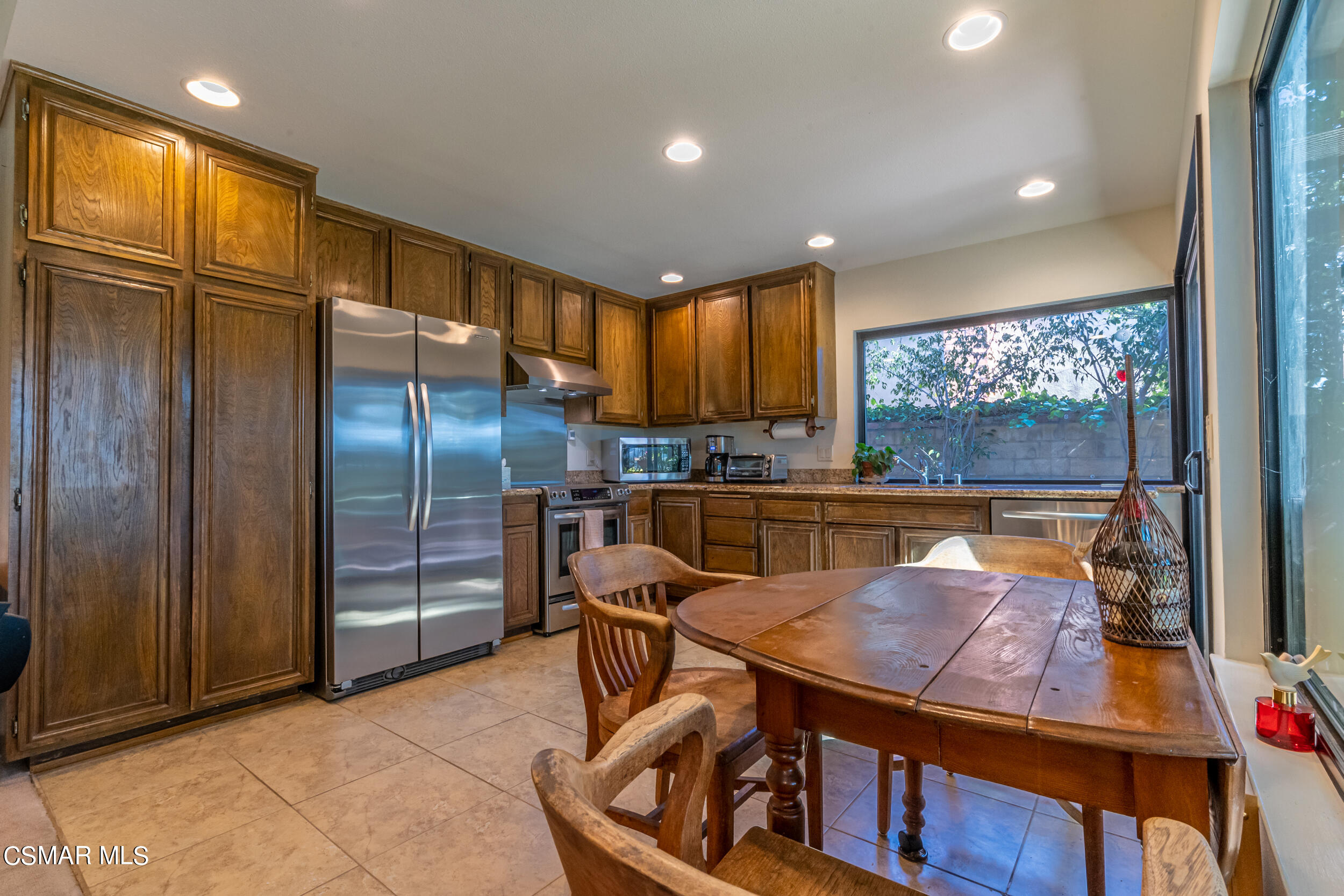 1932 Summer Cloud Drive Thousand Oaks, CA 91362 - Photo 9 of 23 a kitchen with stainless steel appliances granite countertop a refrigerator a oven and a sink