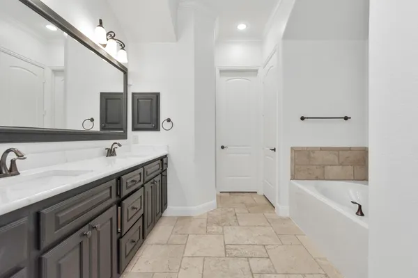 an empty room with closet and windows